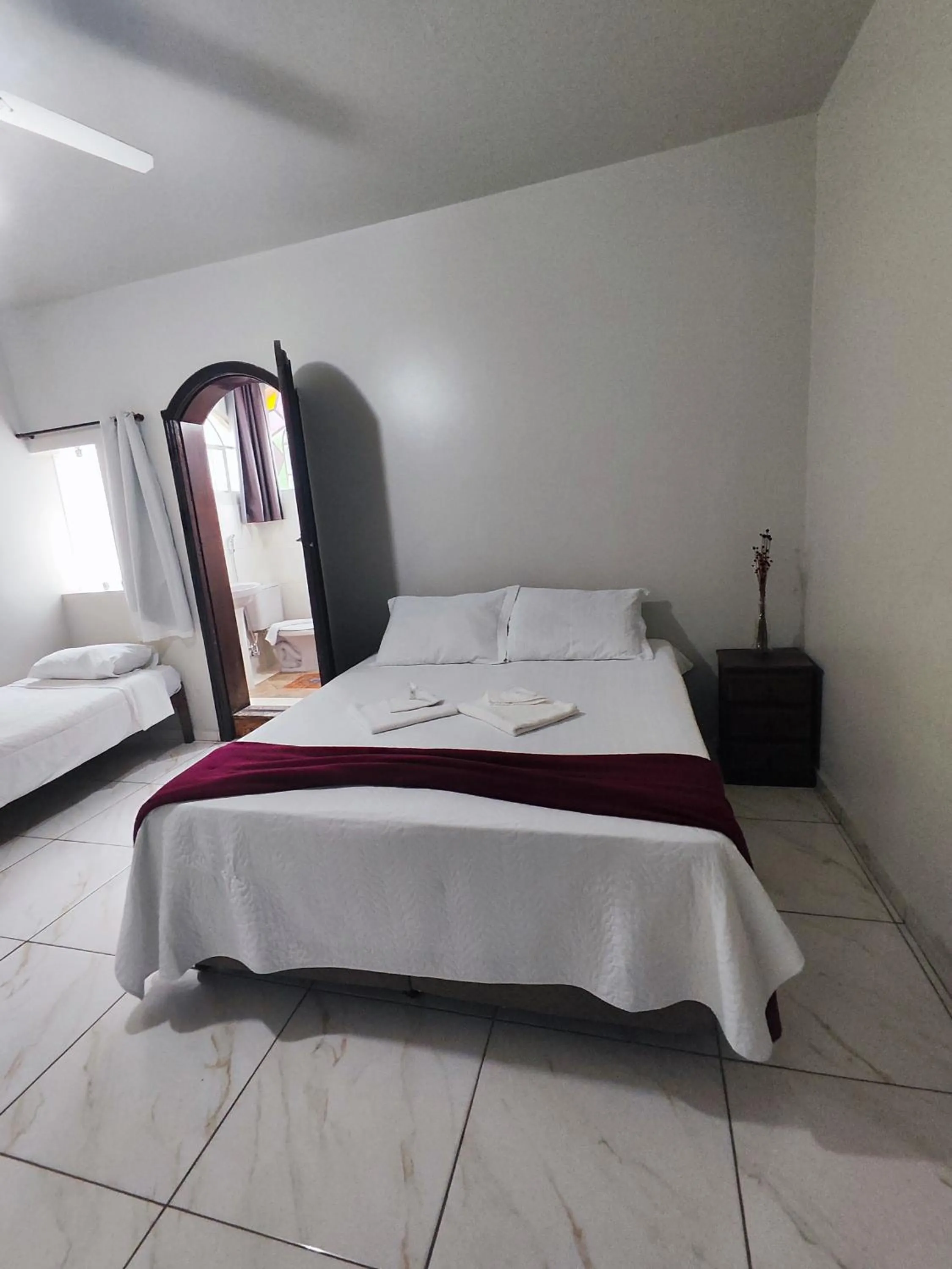Bed in Pousada Sinhá Moça