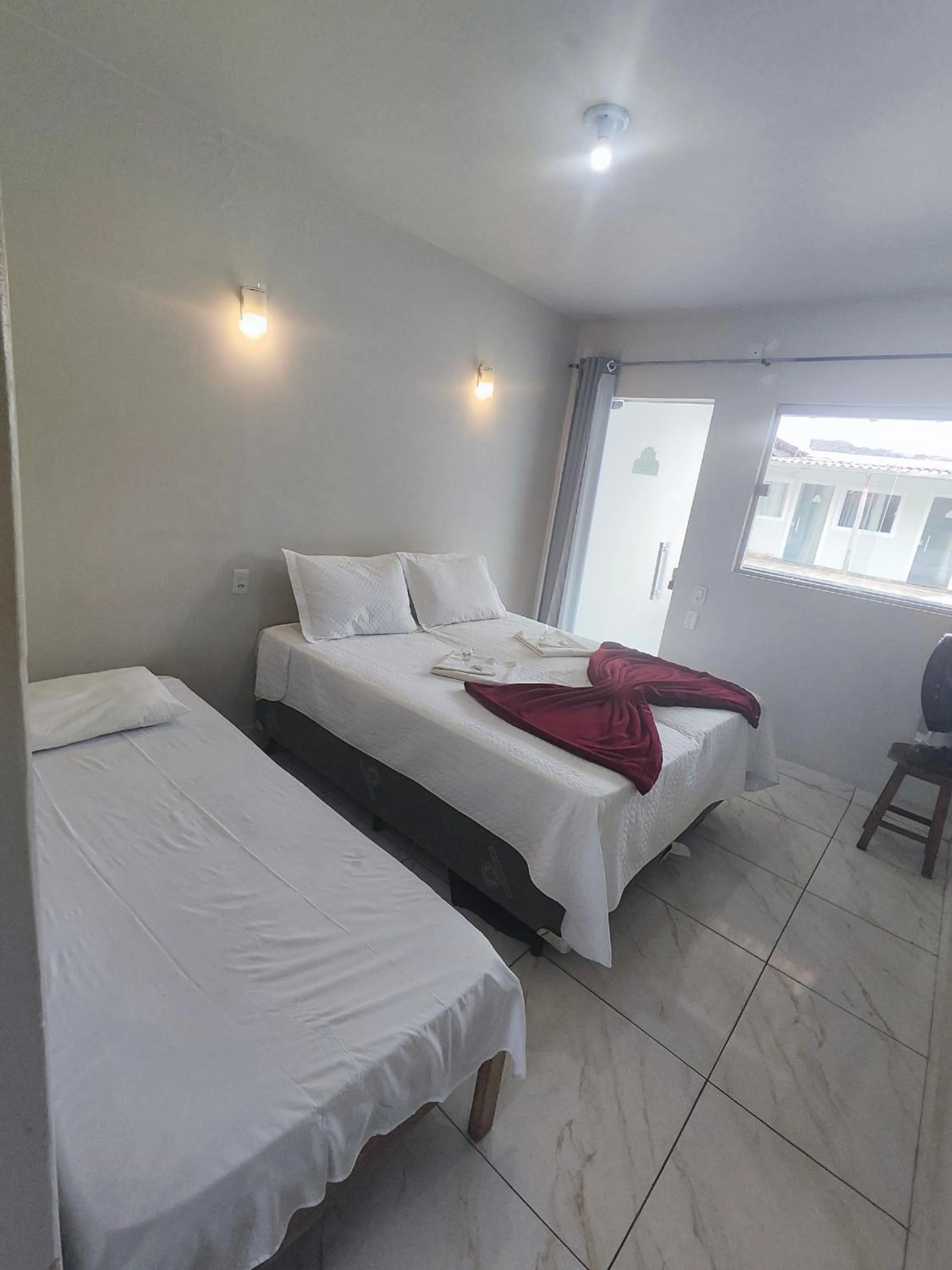 Bed in Pousada Sinhá Moça