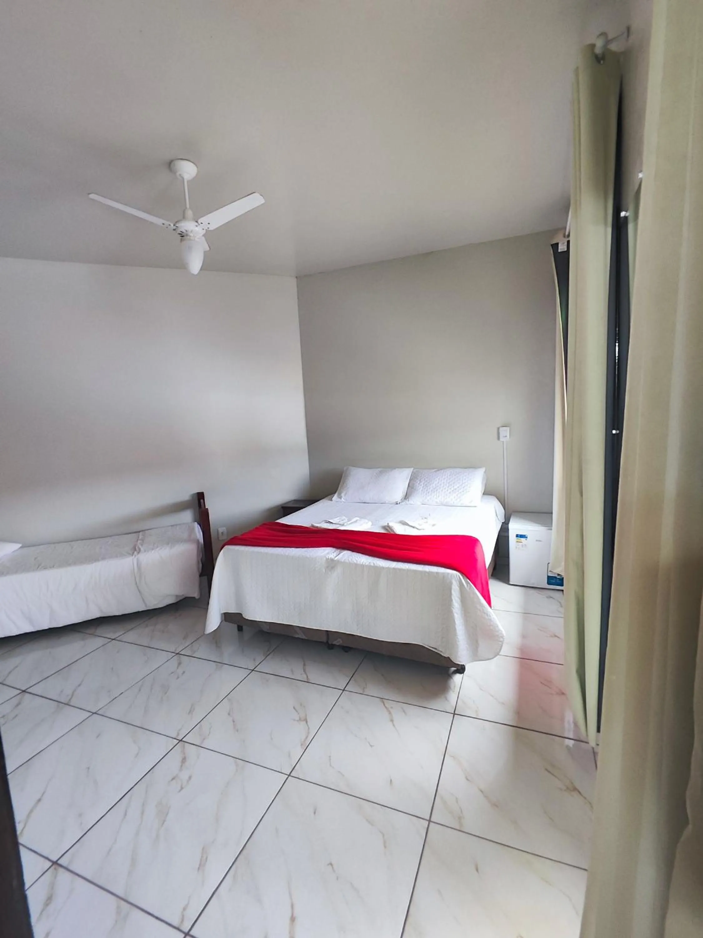 Bed in Pousada Sinhá Moça
