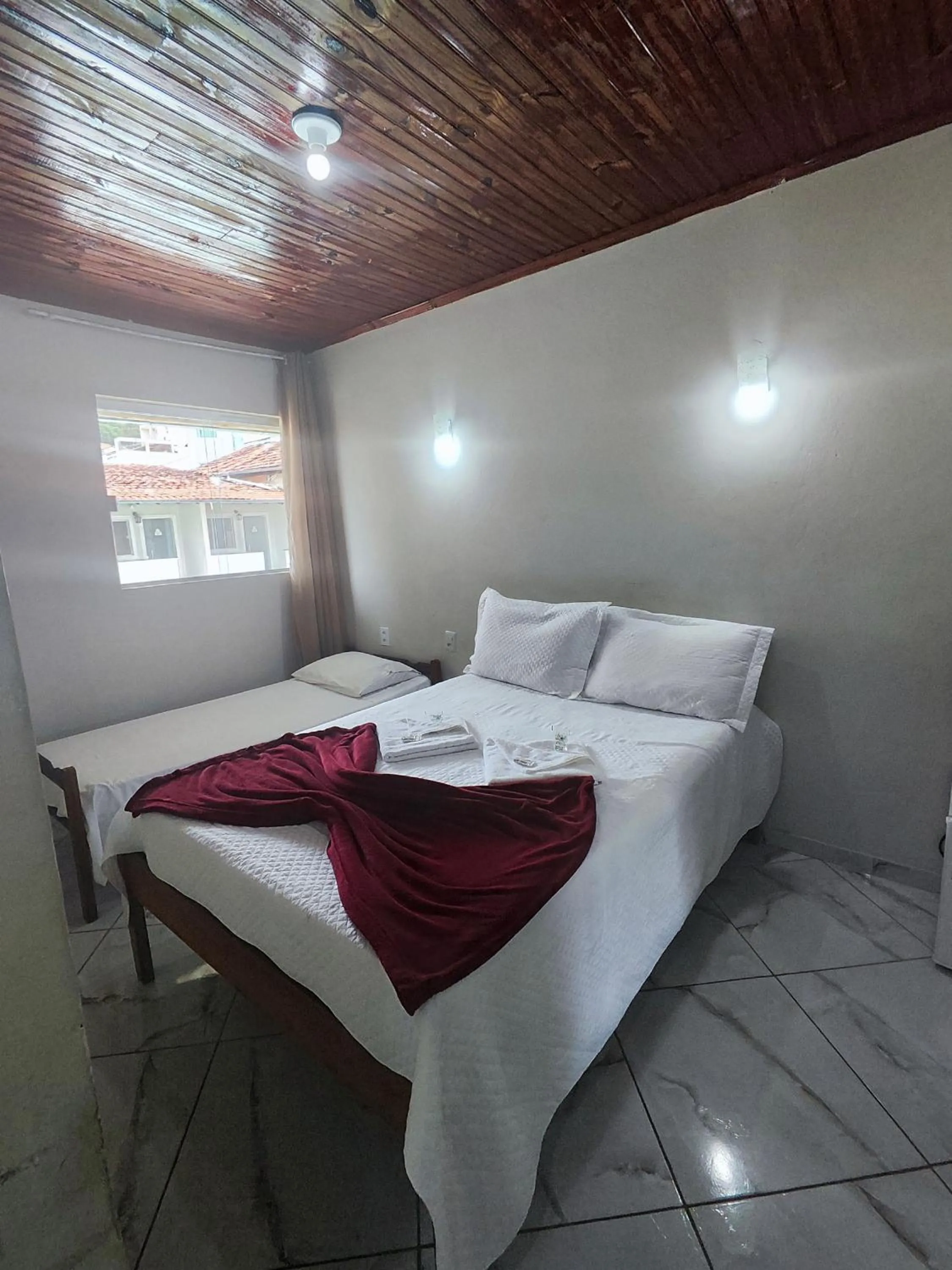Bed in Pousada Sinhá Moça