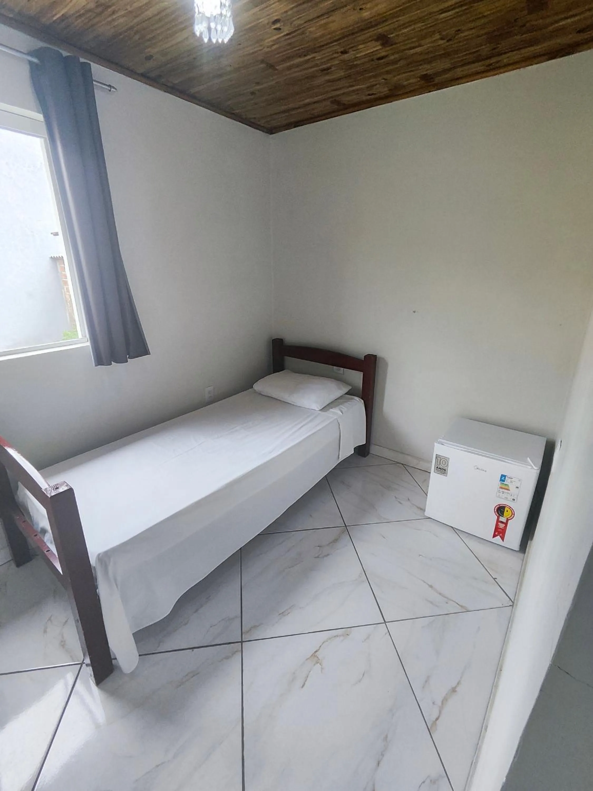 Bed in Pousada Sinhá Moça