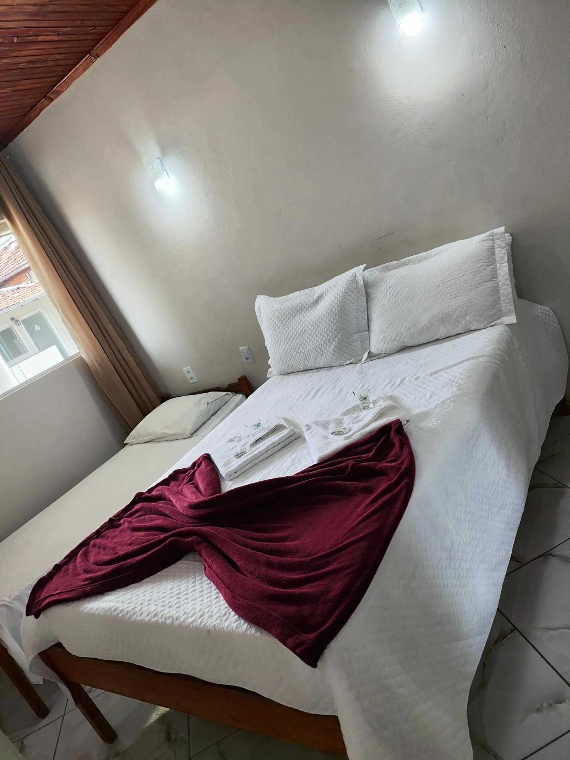 Bed in Pousada Sinhá Moça