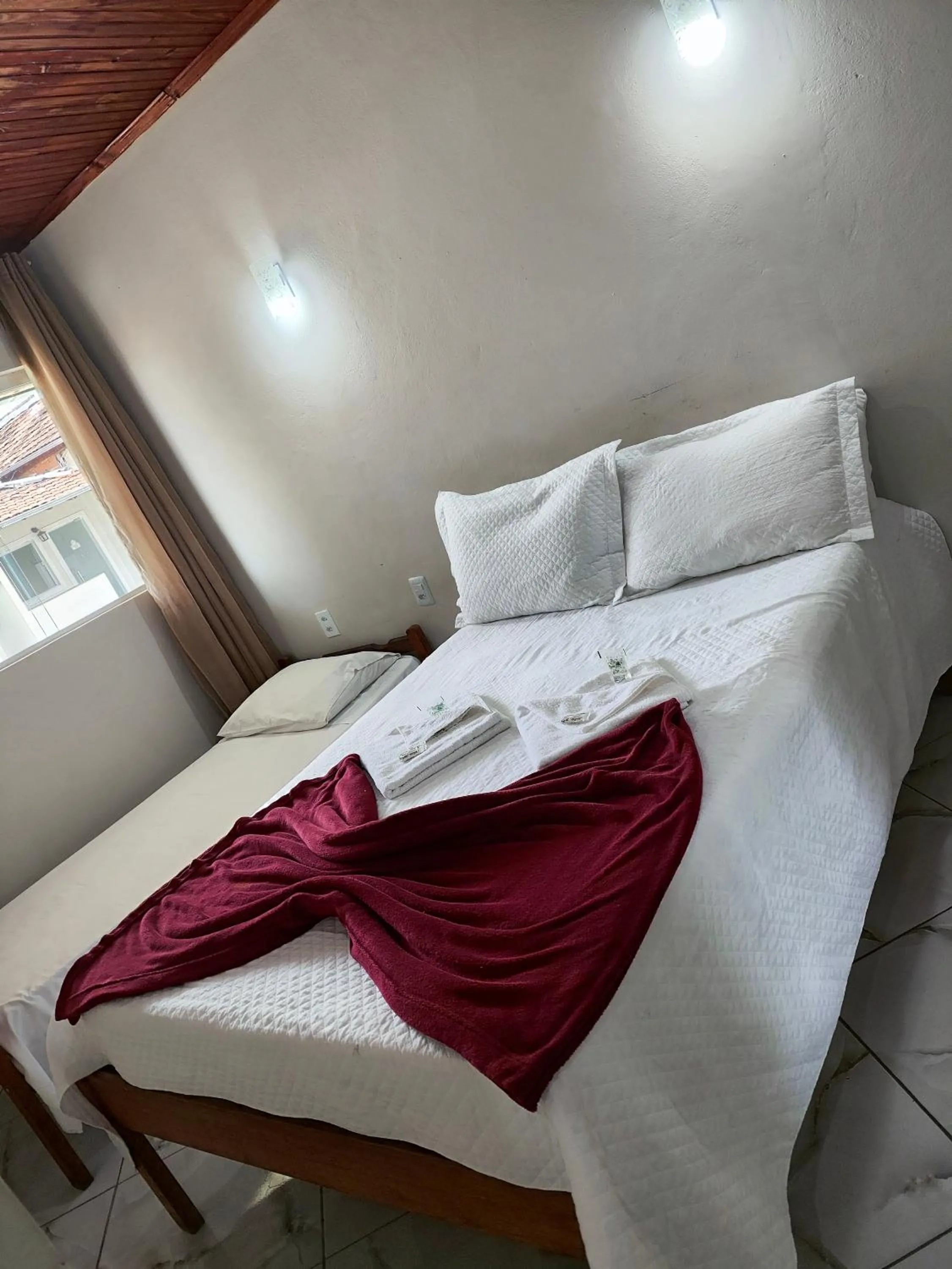 Bed in Pousada Sinhá Moça