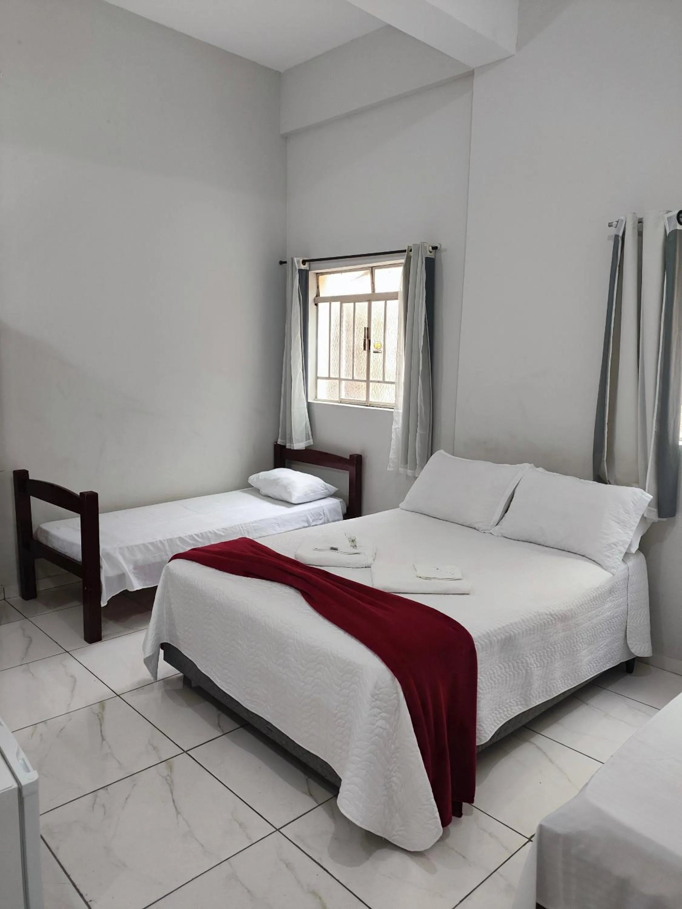 Bed in Pousada Sinhá Moça