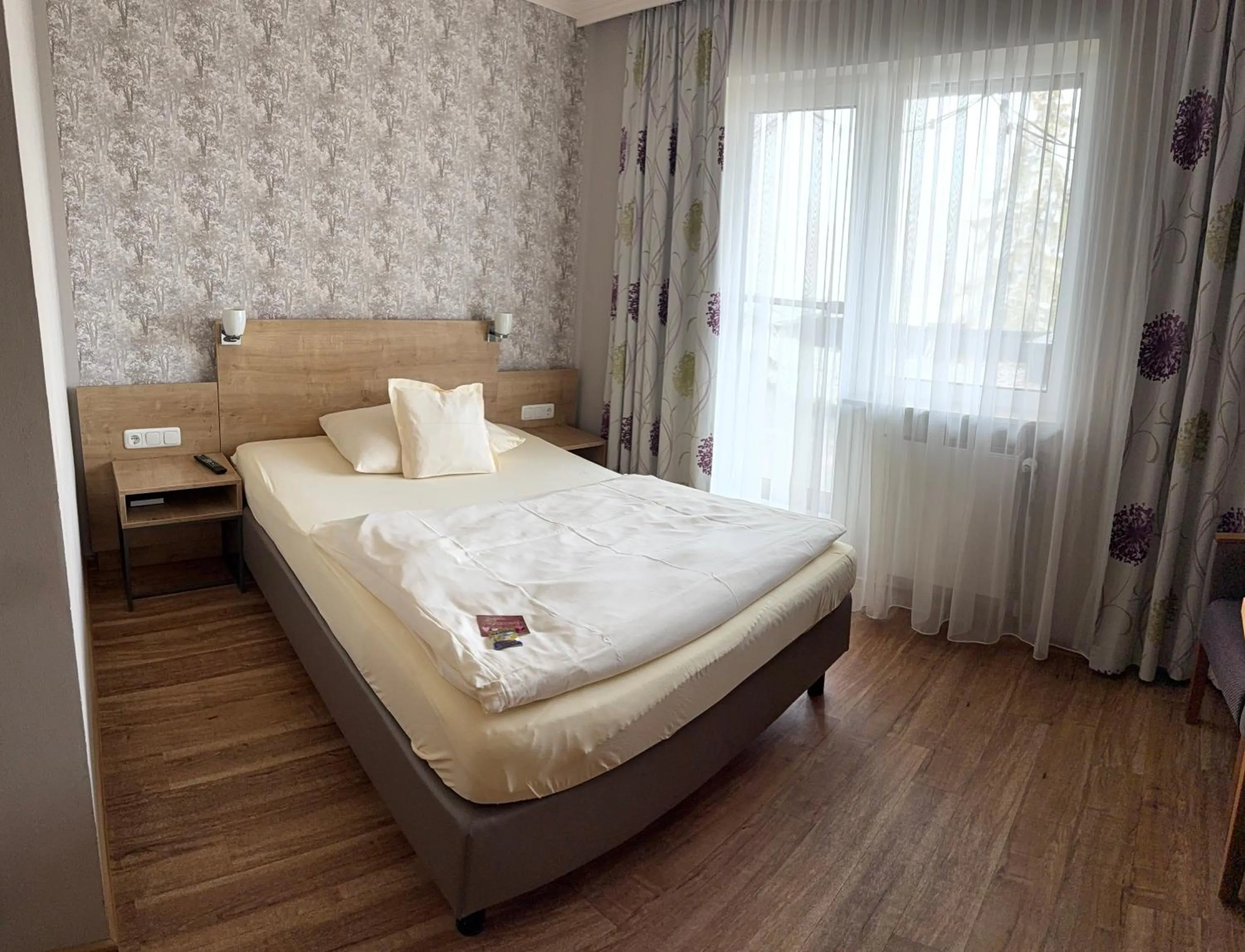 Photo of the whole room, Bed in Landhotel Kuralpe Kreuzhof