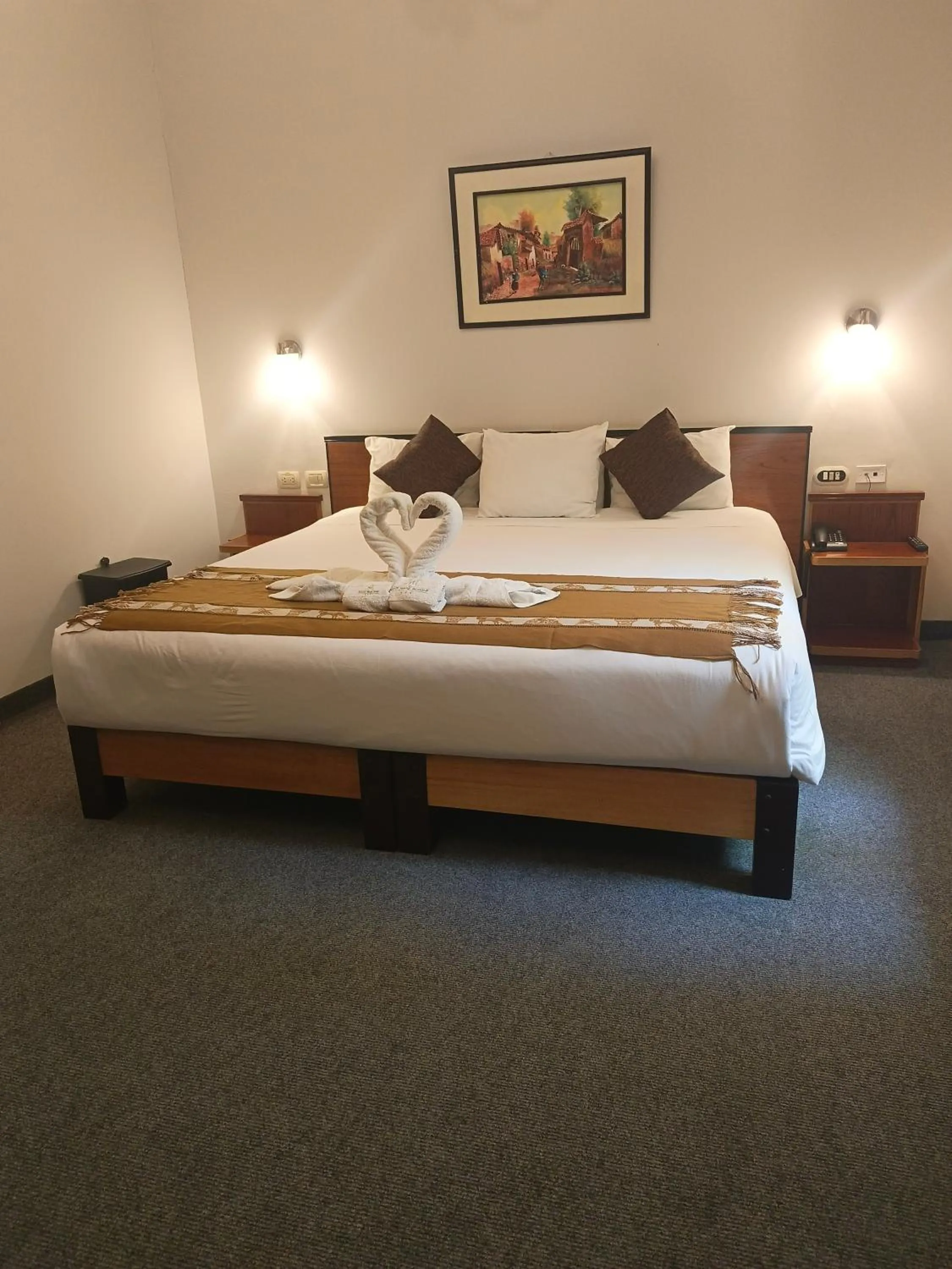 Bed in Colonial Plaza Hotel