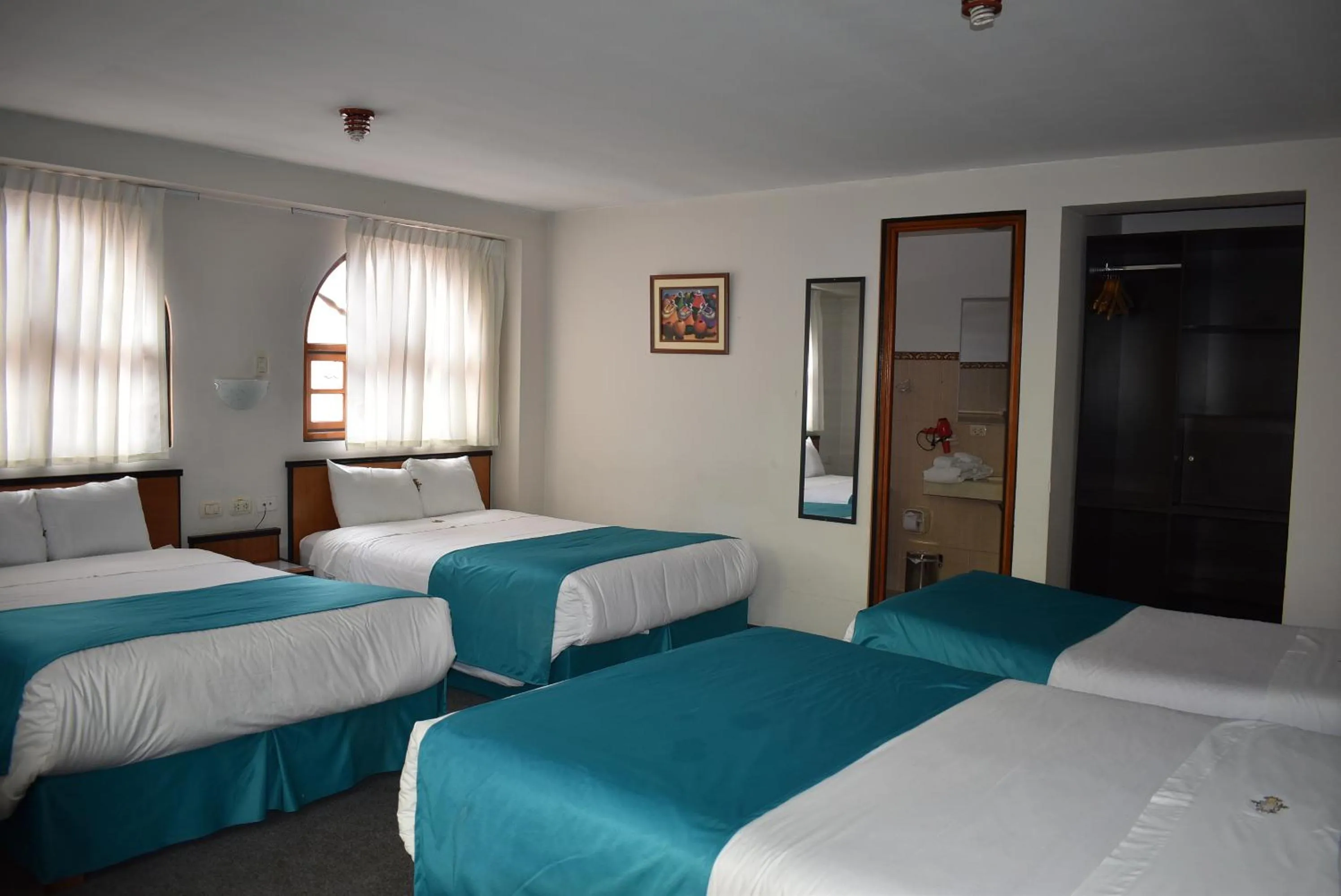 Bed in Colonial Plaza Hotel