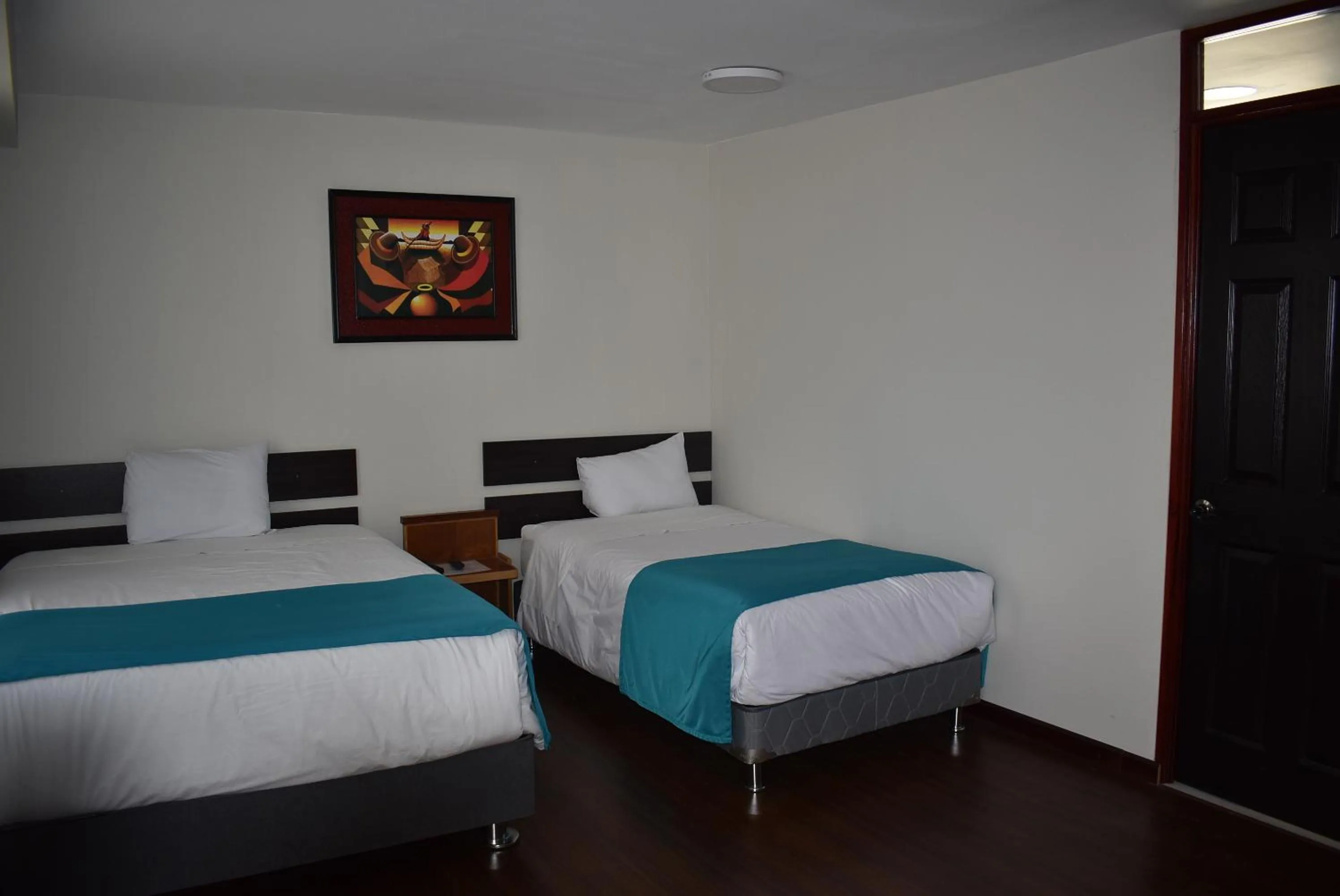 Bed in Colonial Plaza Hotel