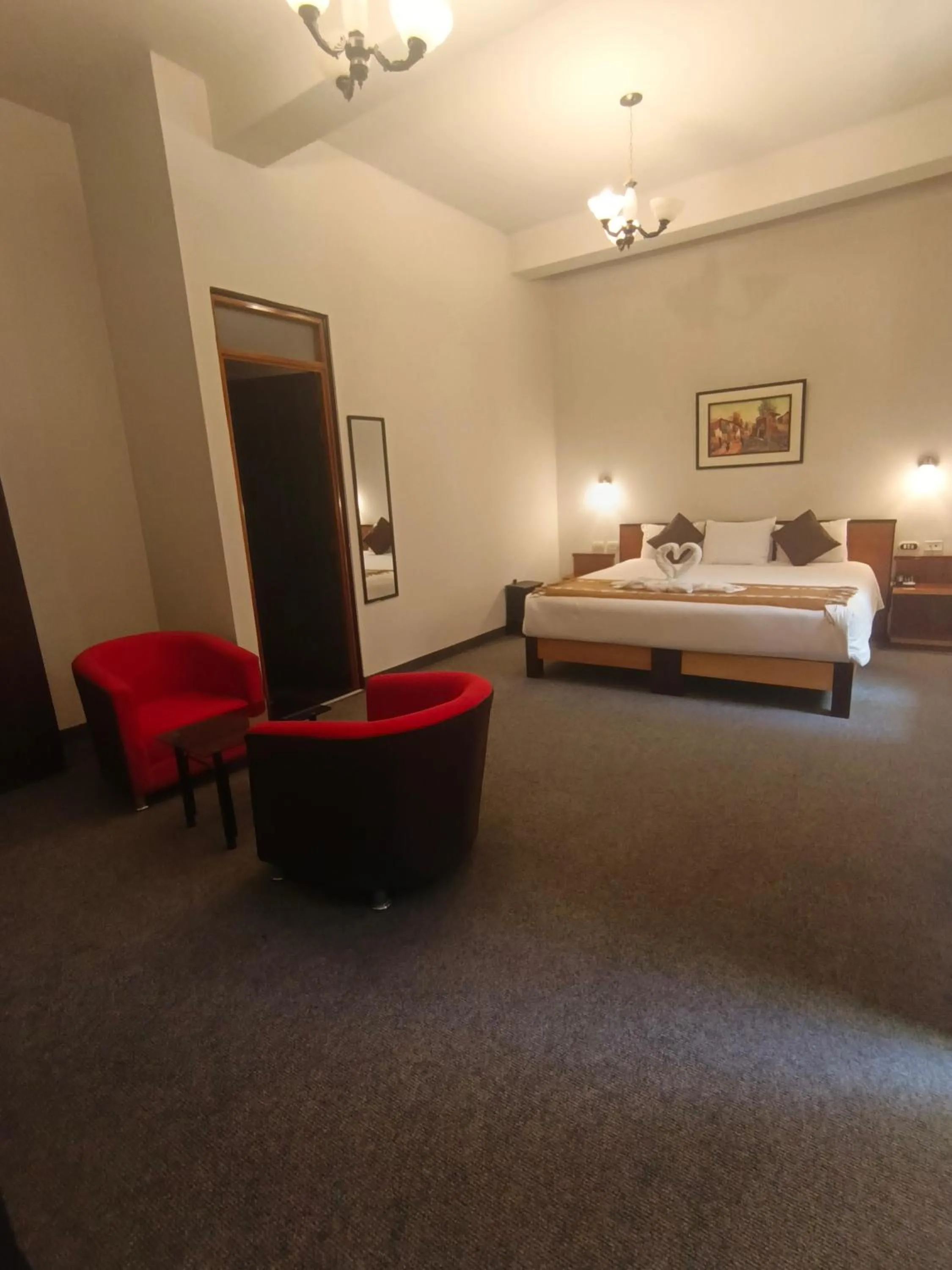 Bed in Colonial Plaza Hotel