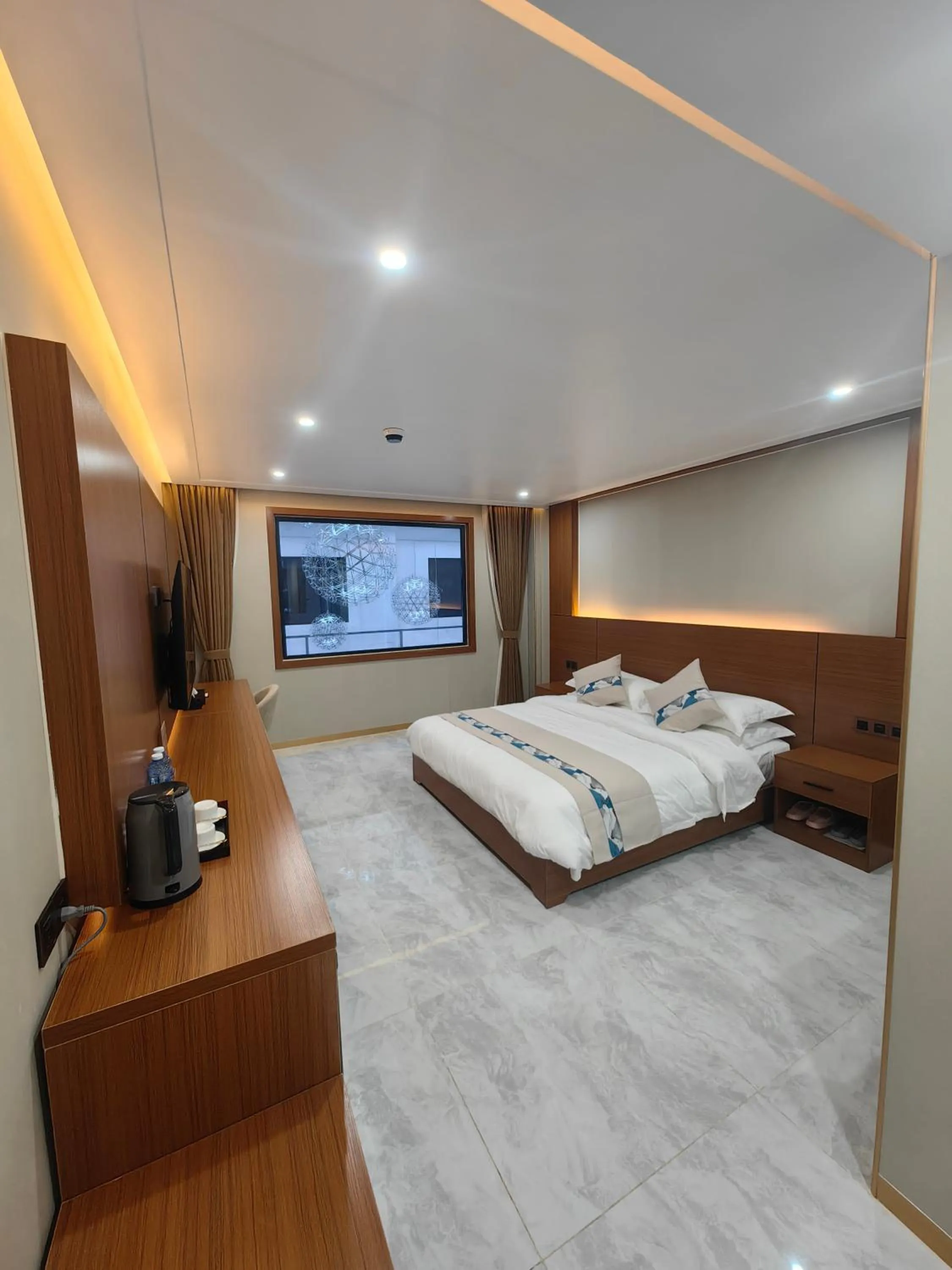 Bed in Royal International Hotel & Mall