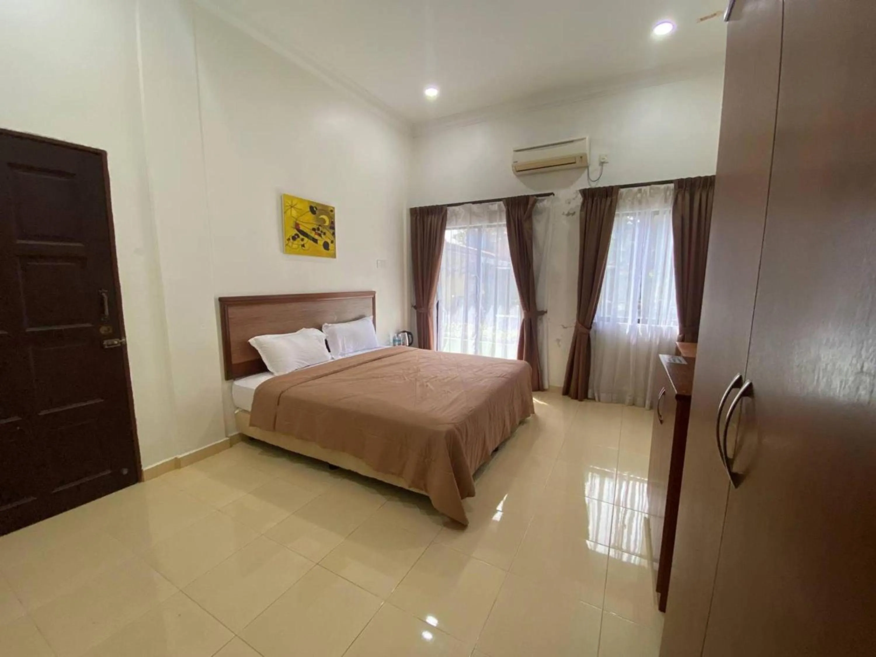 Bedroom, Bed in Capital O 91094 Hotel & Chalet Sportfishing