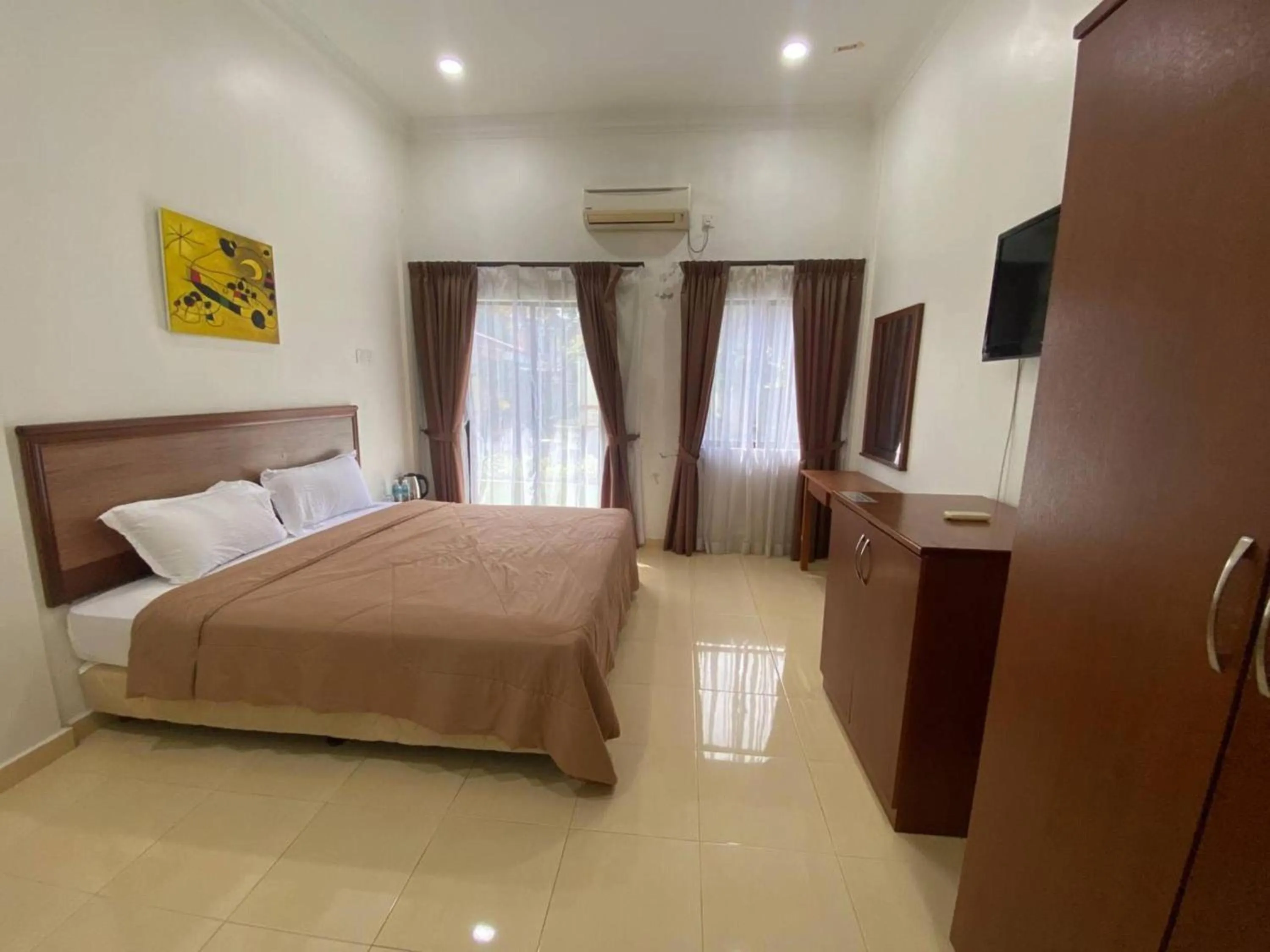 Photo of the whole room, Bed in Capital O 91094 Hotel & Chalet Sportfishing