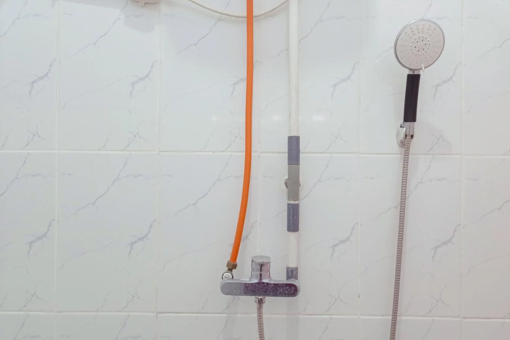 Bathroom in Urbanview Hotel at Guest House Bukit Sion Bengkulu