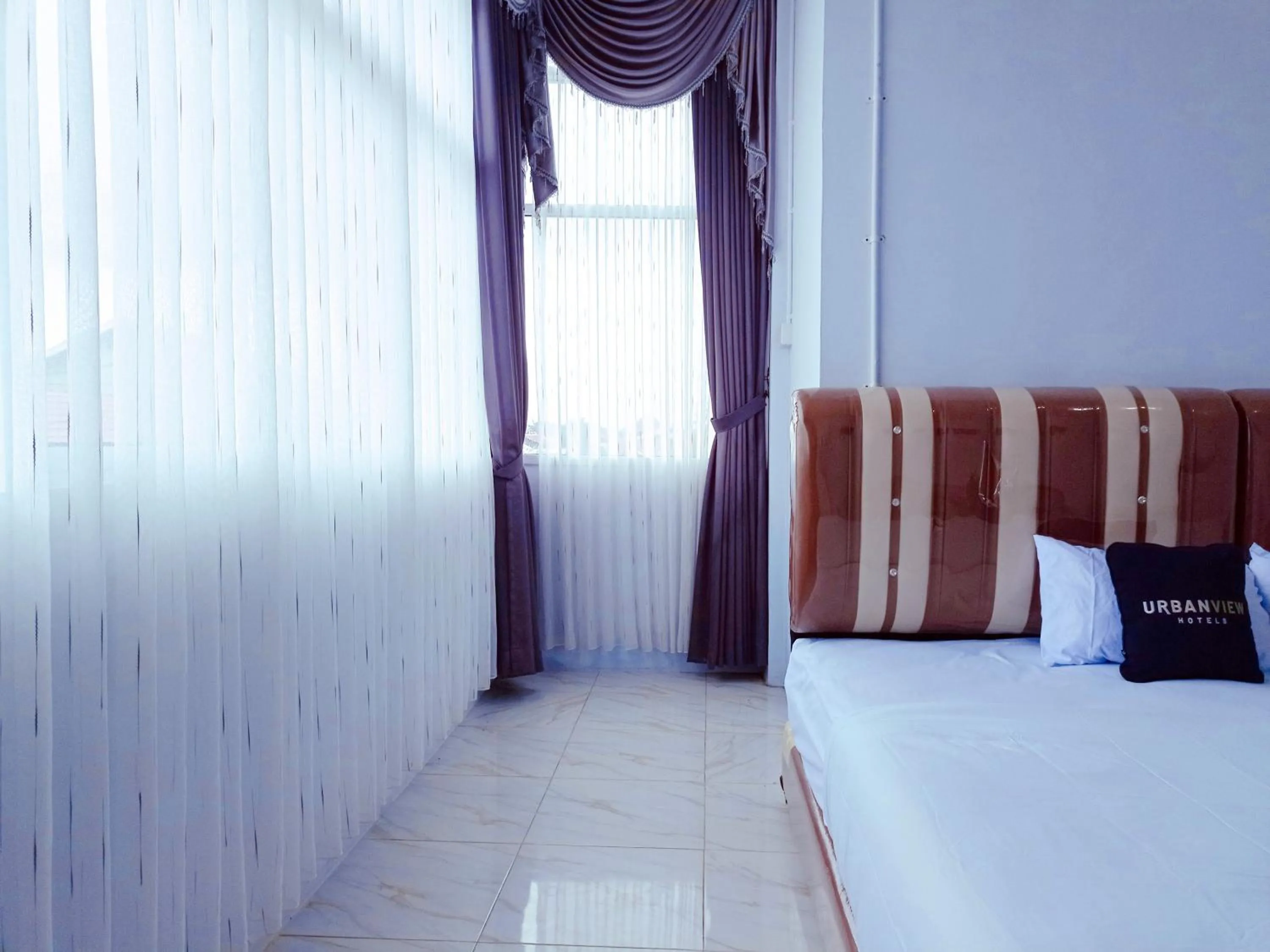 Bedroom, Bed in Urbanview Hotel at Guest House Bukit Sion Bengkulu