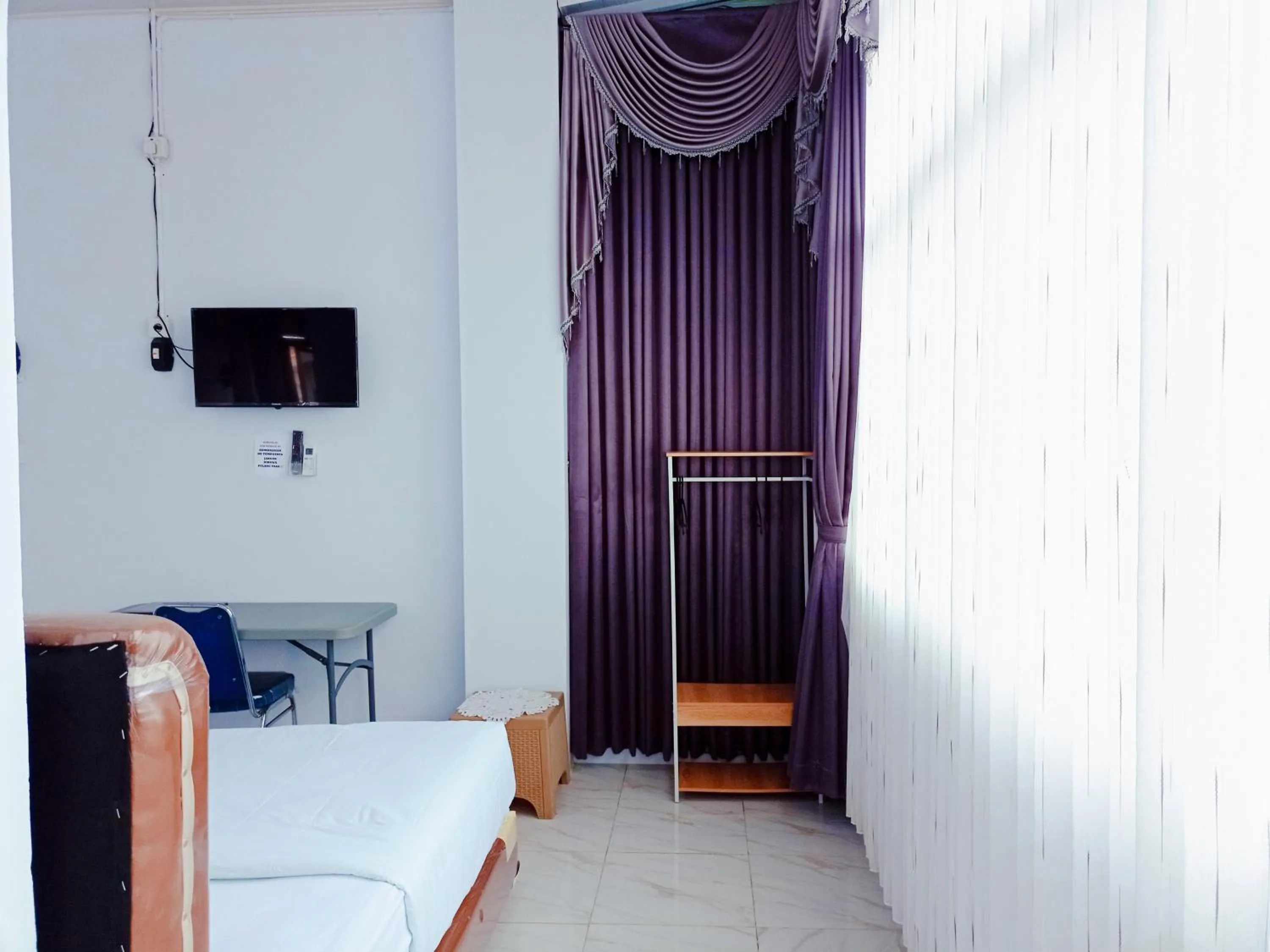 Bedroom in Urbanview Hotel at Guest House Bukit Sion Bengkulu