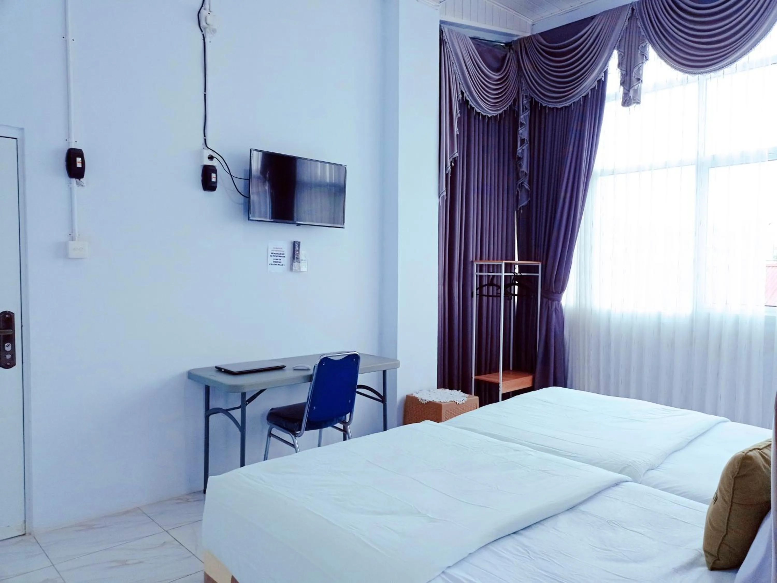 Bedroom, Bed in Urbanview Hotel at Guest House Bukit Sion Bengkulu