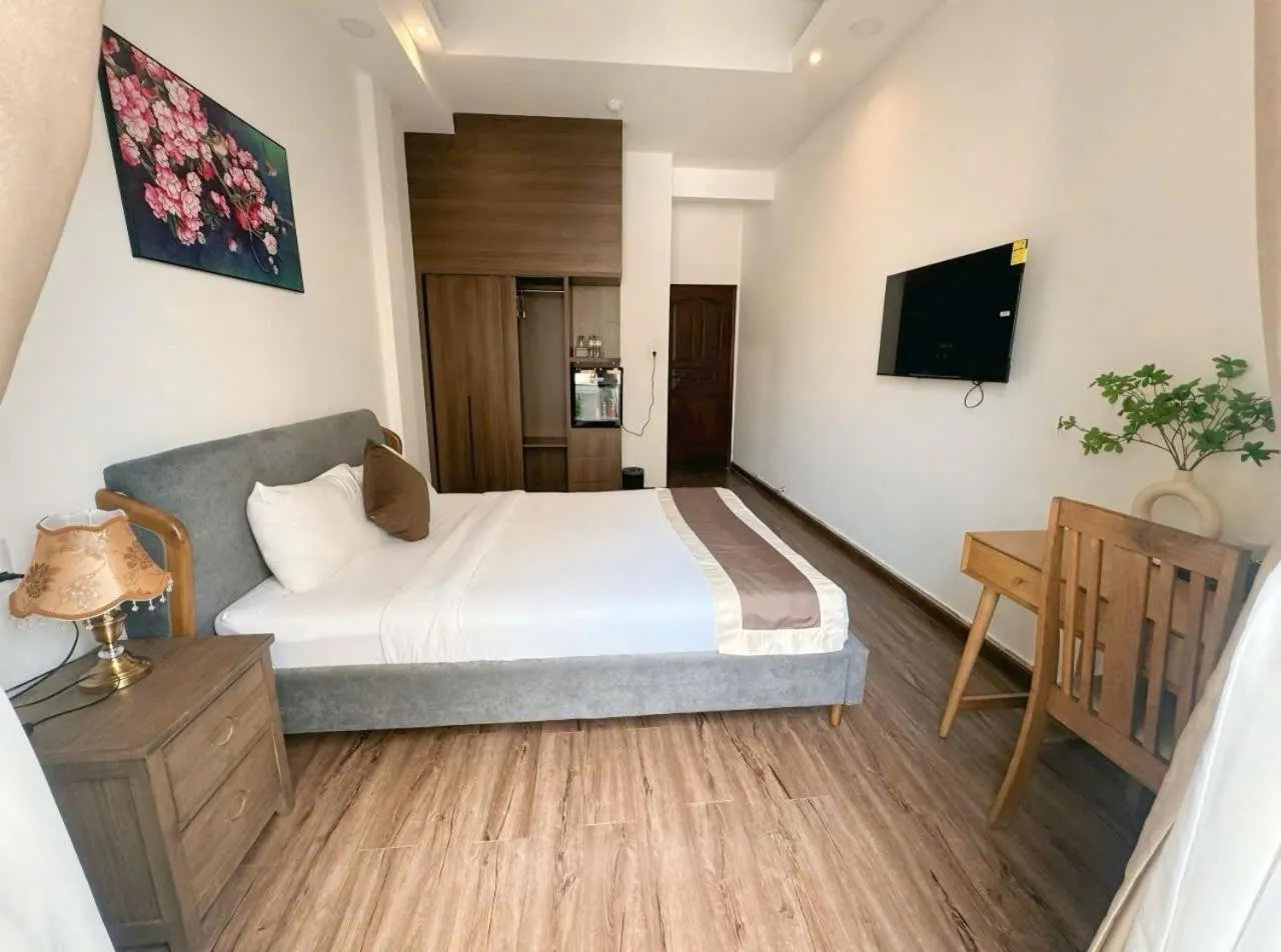 Communal lounge/ TV room, Bed in Bros Citihouse Hotel