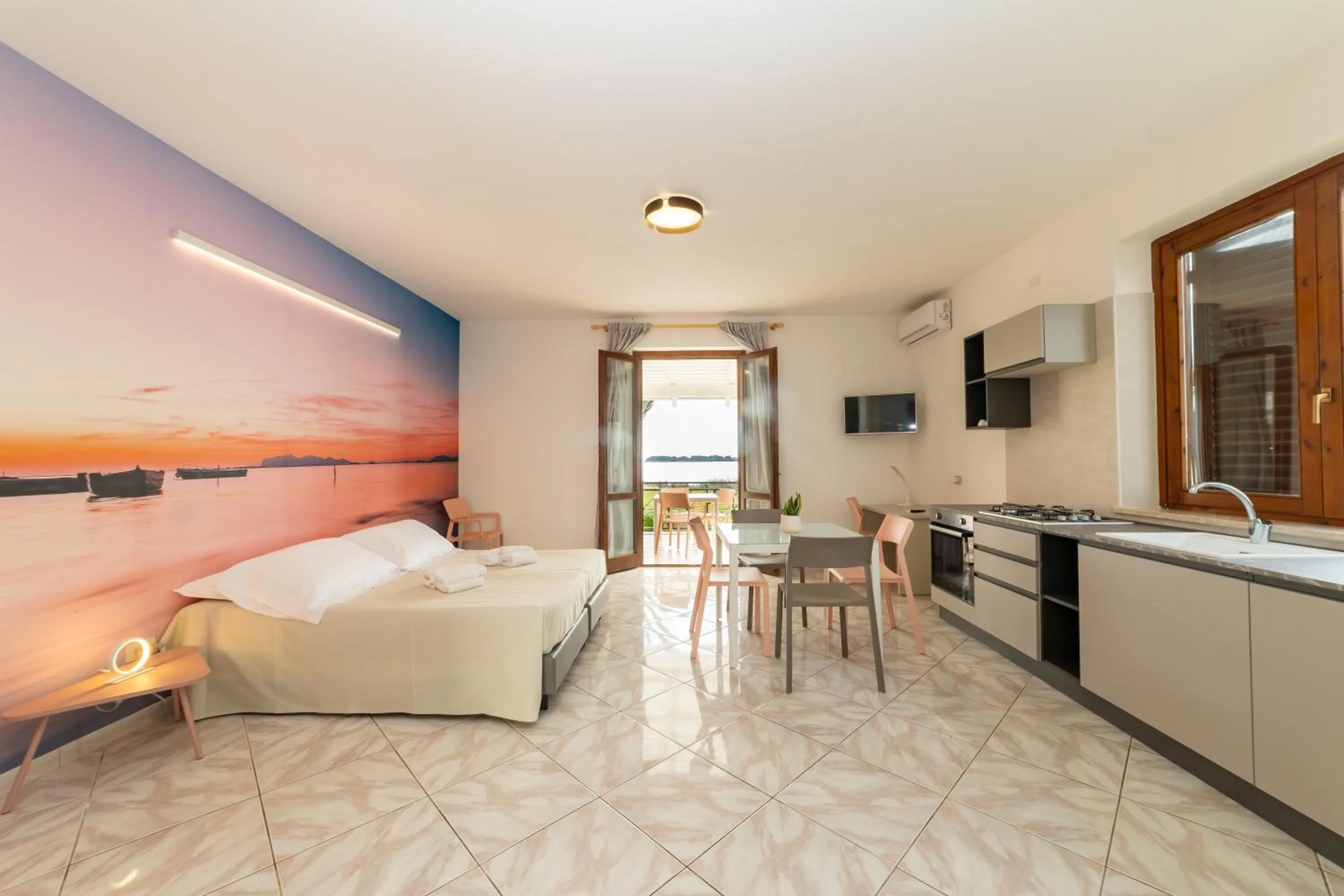 Seating area, Bed in Resort Santa Maria Hotel