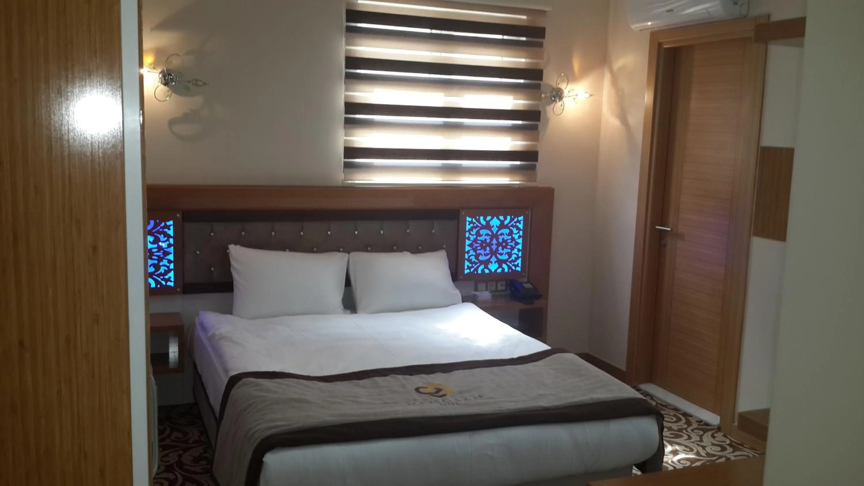 Bed in Demosan City Hotel