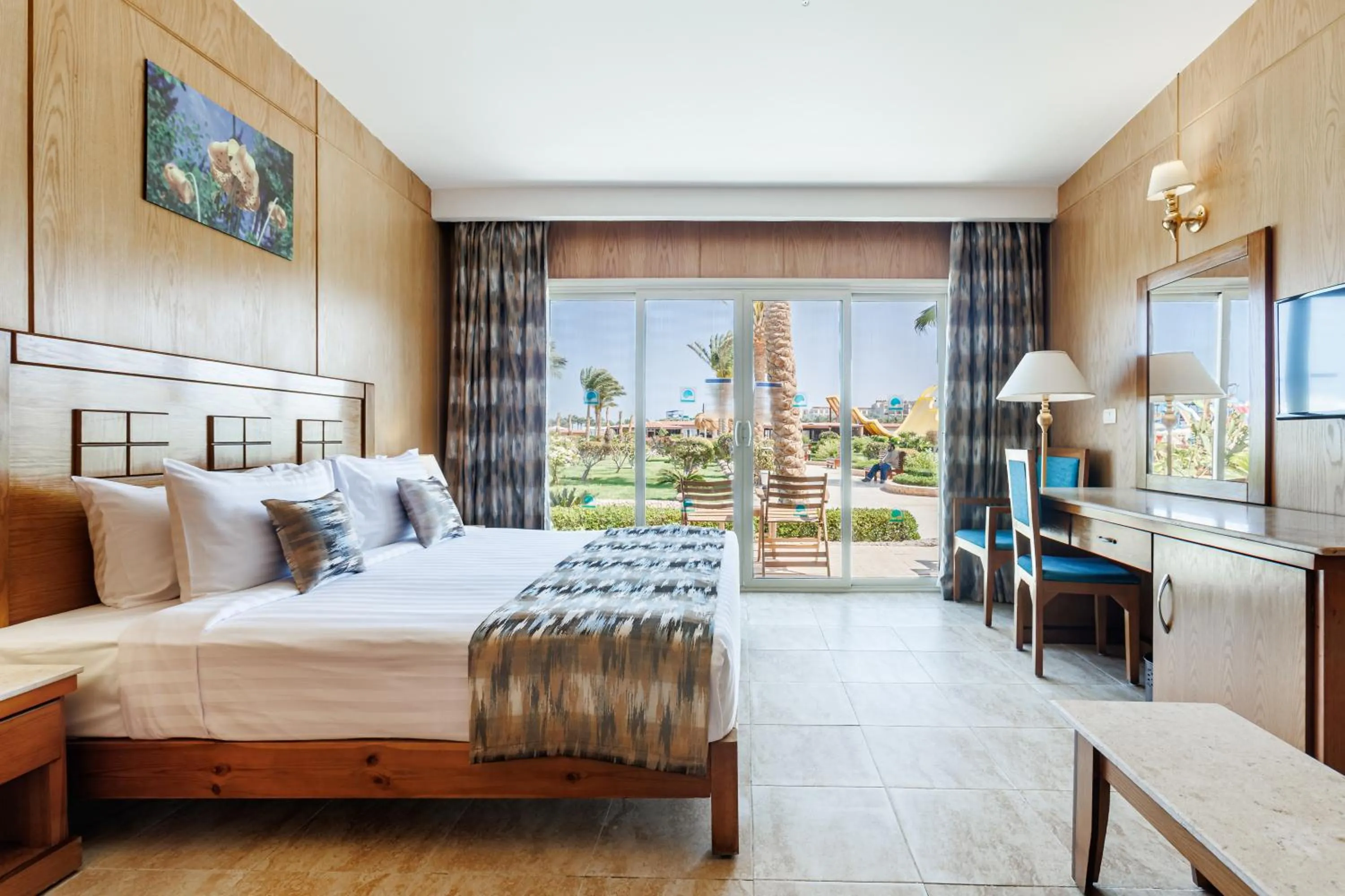 Bed in Sunrise Alora Aqua Park Resort