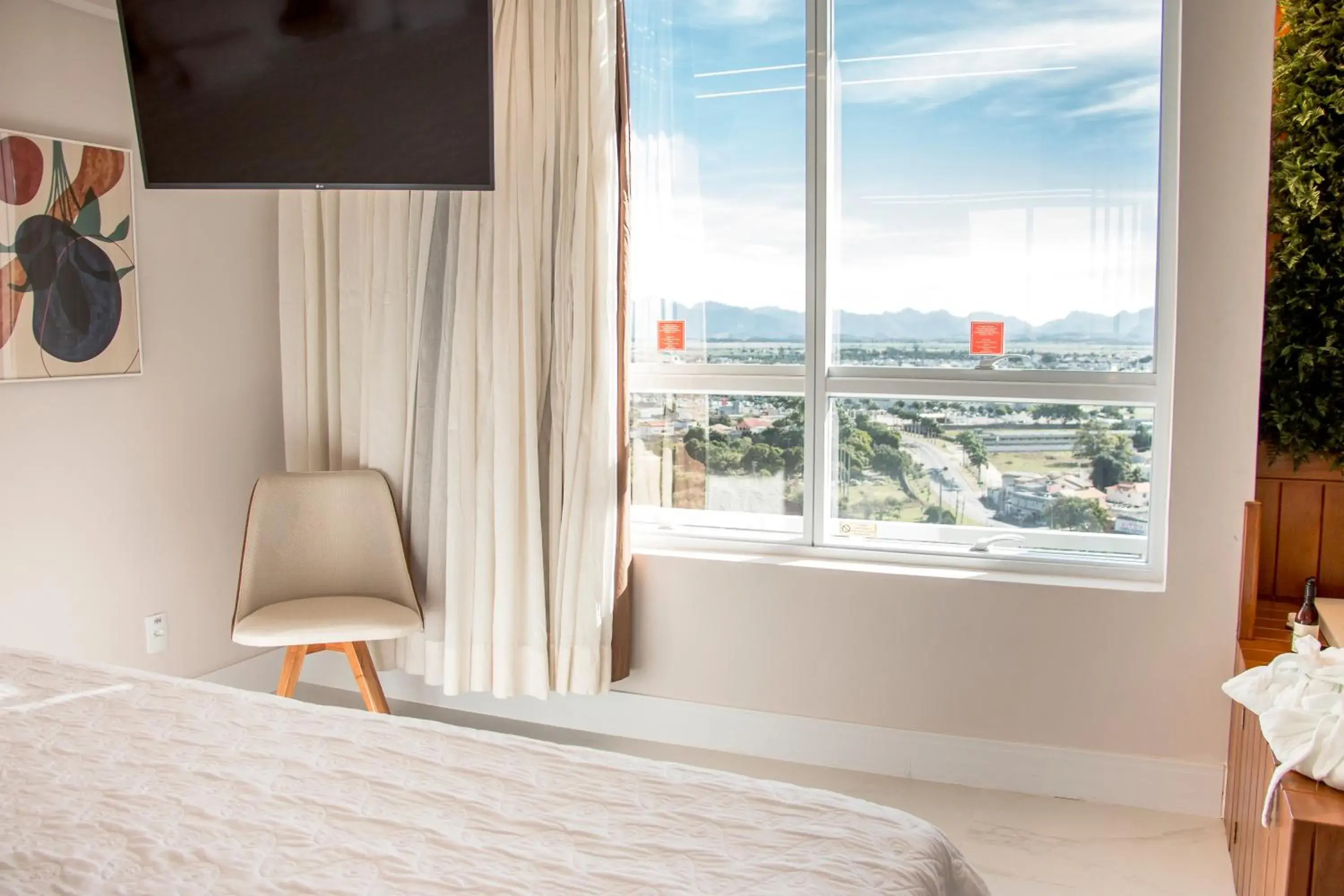 View (from property/room), Bed in Ramada Hotel & Suites Campos Pelinca View (from property/room), Bed in Ramada Hotel & Suites Campos Pelinca