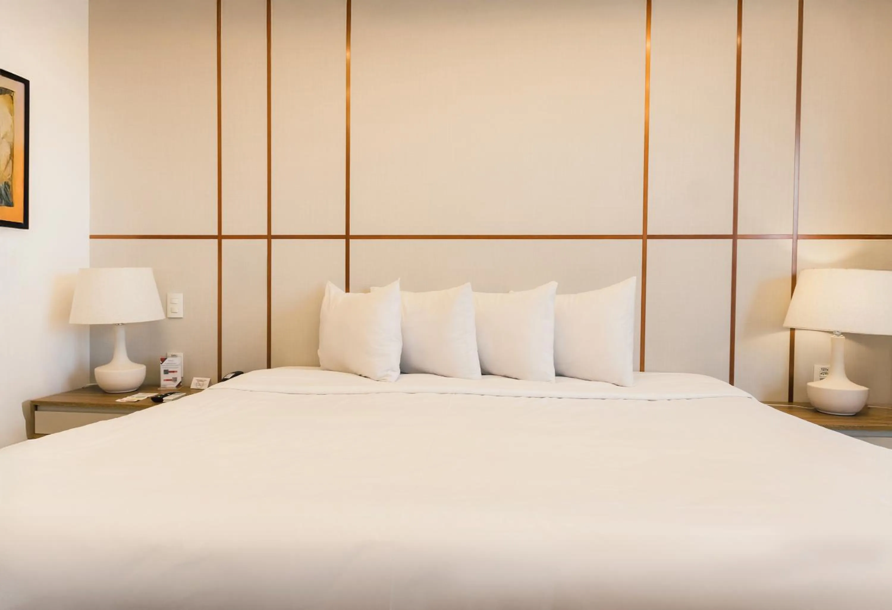 Bed in Ramada Hotel & Suites Campos Pelinca