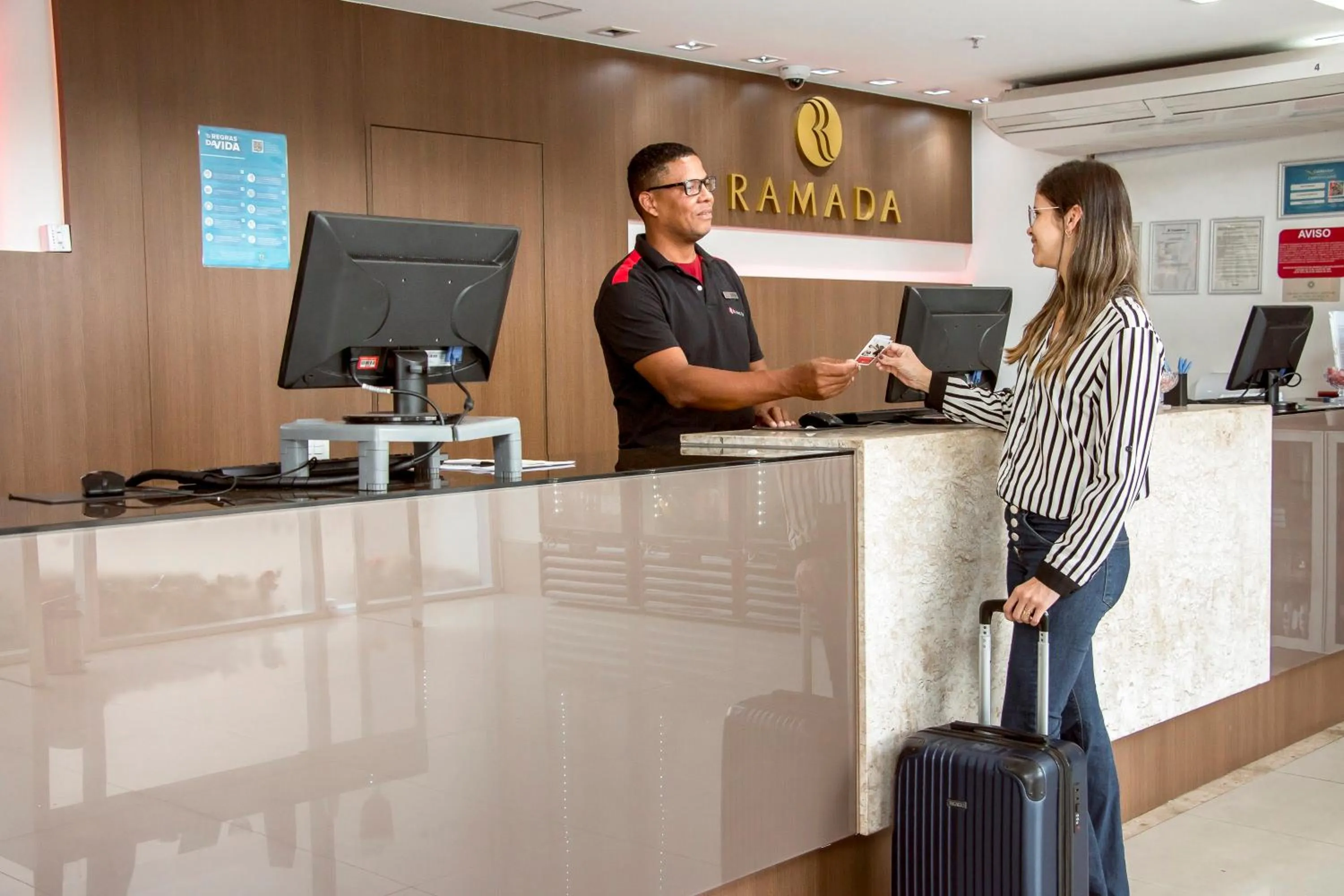 Lobby or reception in Ramada Hotel & Suites Campos Pelinca