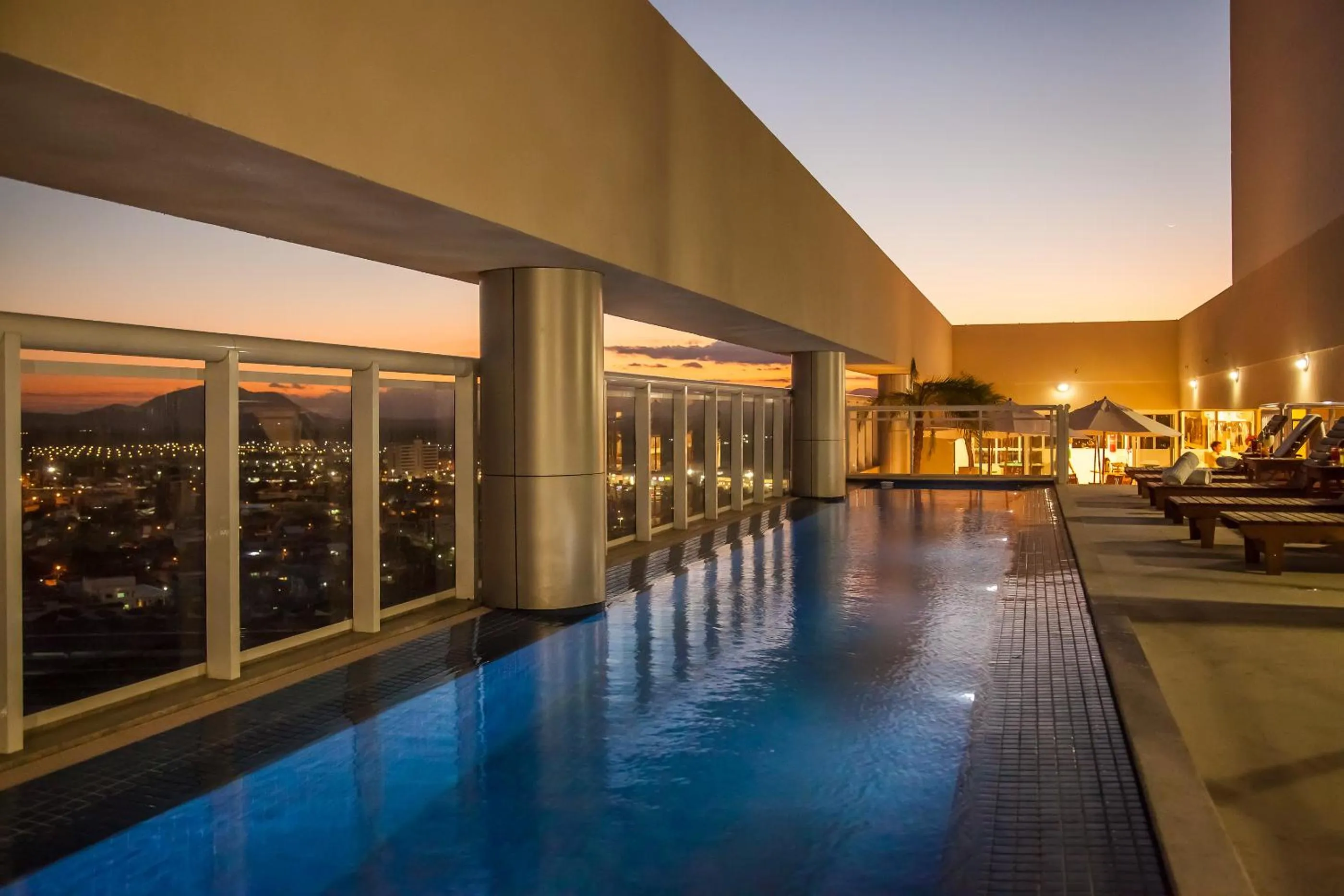 Swimming pool in Ramada Hotel & Suites Campos Pelinca