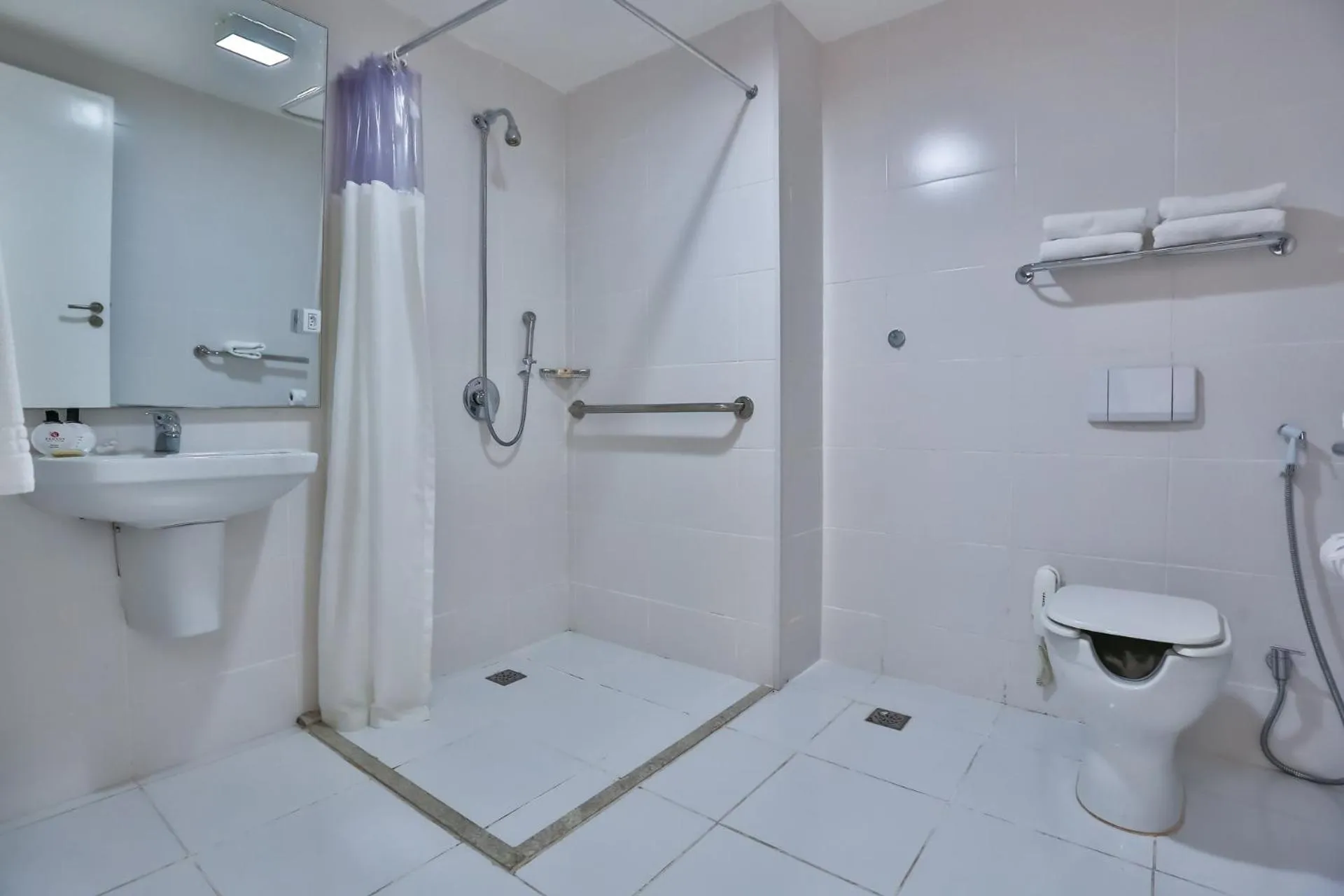 Bathroom in Ramada Hotel & Suites Campos Pelinca