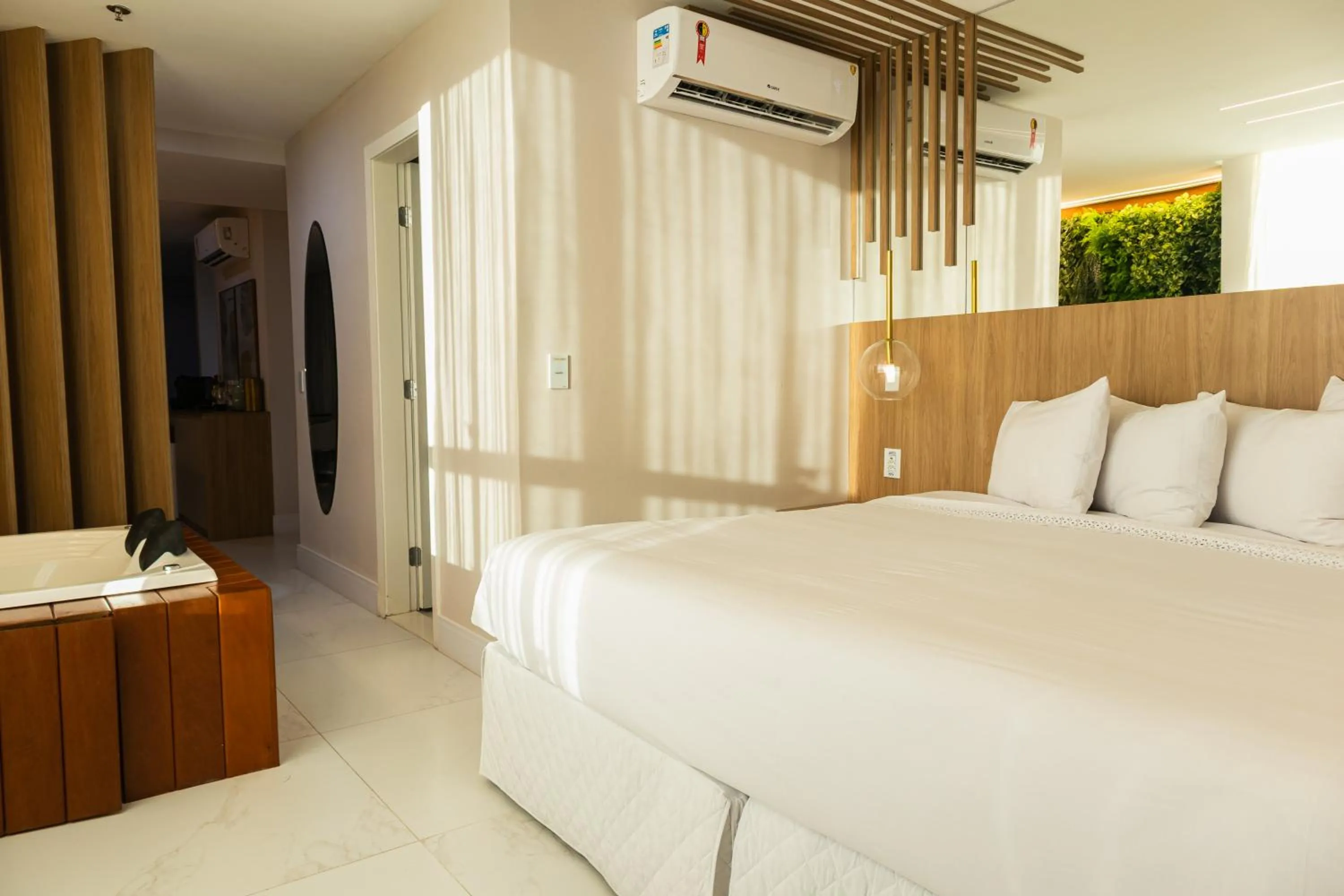 Bed in Ramada Hotel & Suites Campos Pelinca