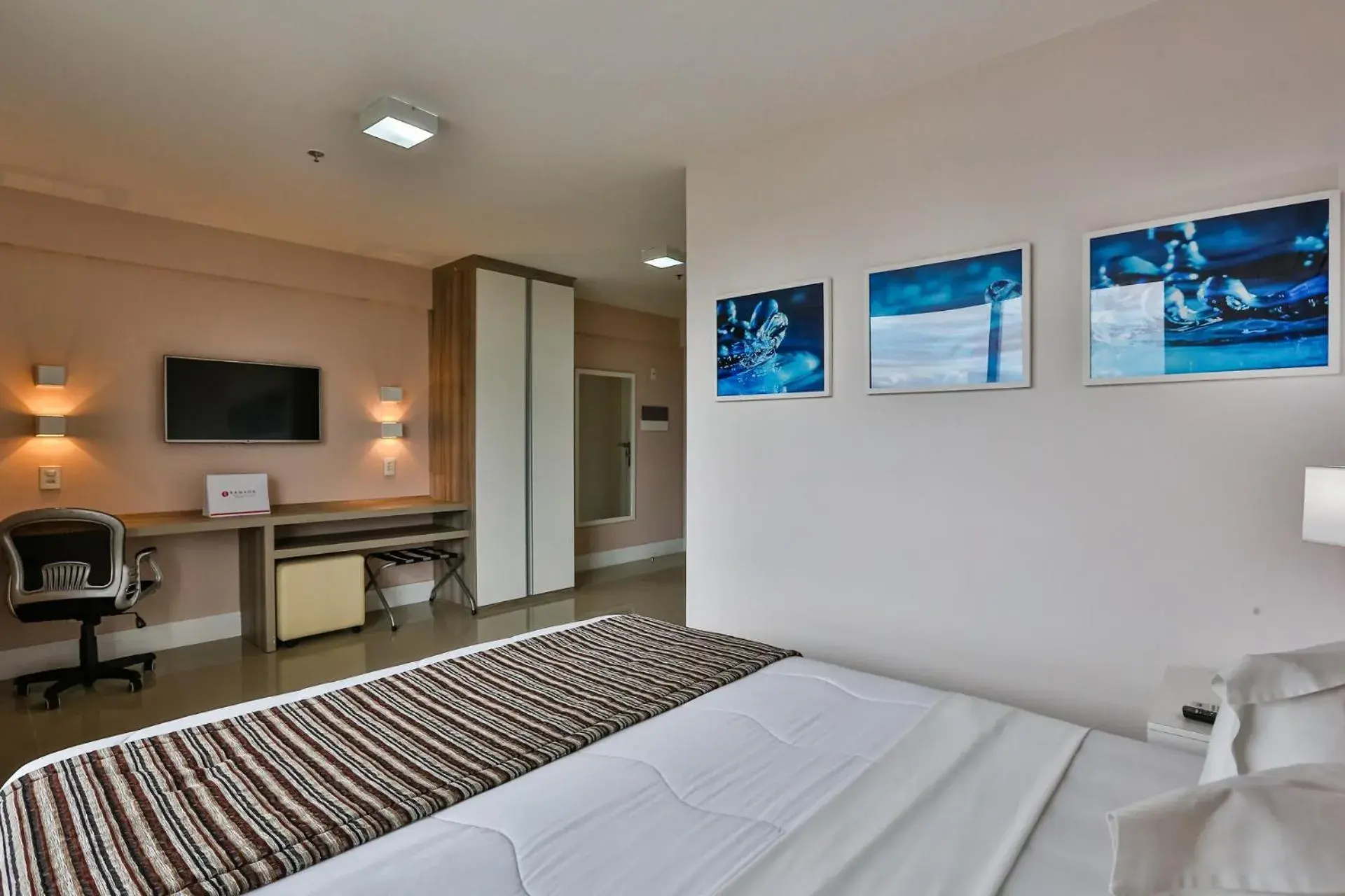 Photo of the whole room, Bed in Ramada Hotel & Suites Campos Pelinca Photo of the whole room, Bed in Ramada Hotel & Suites Campos Pelinca