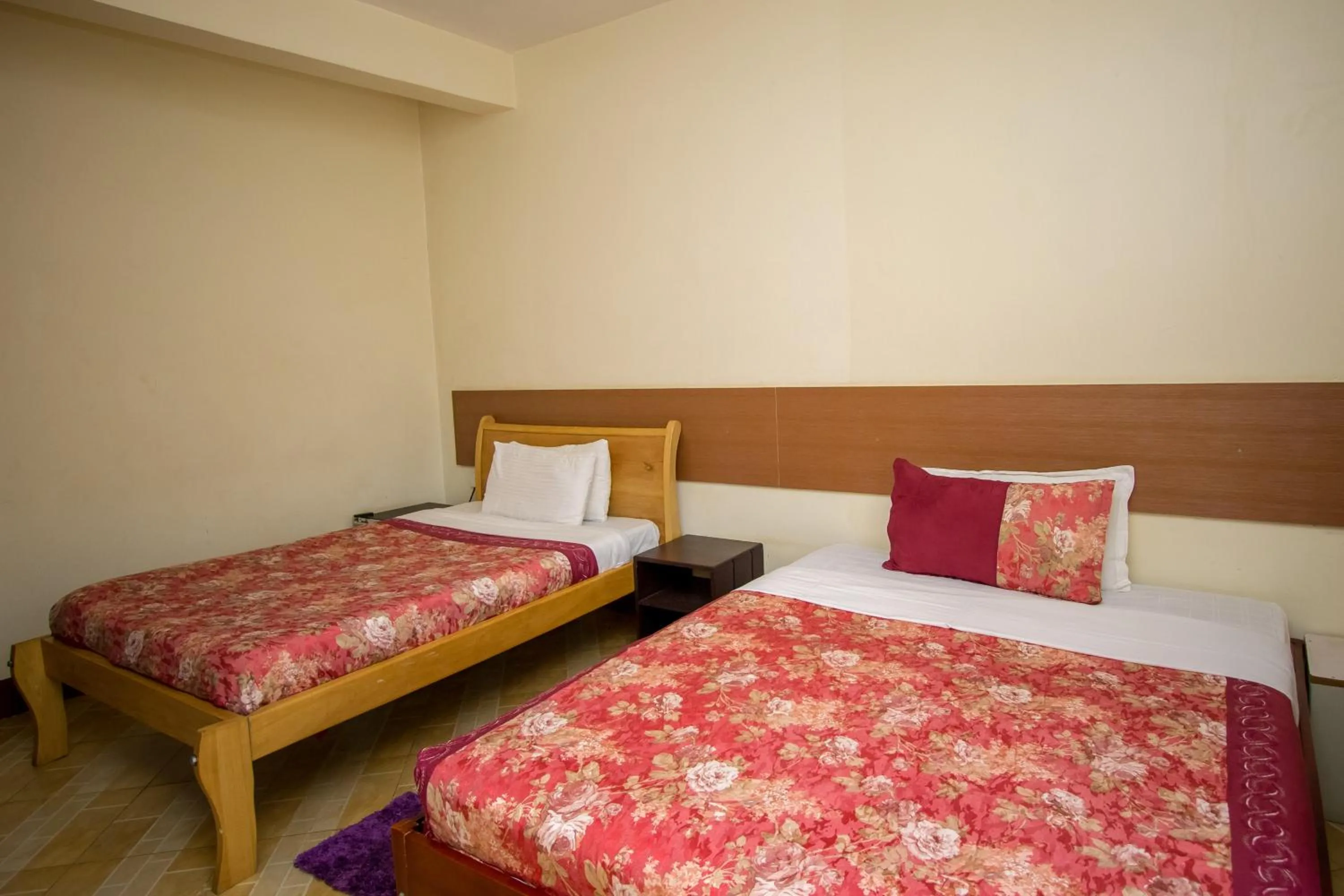 Bed in Grand Global Hotel