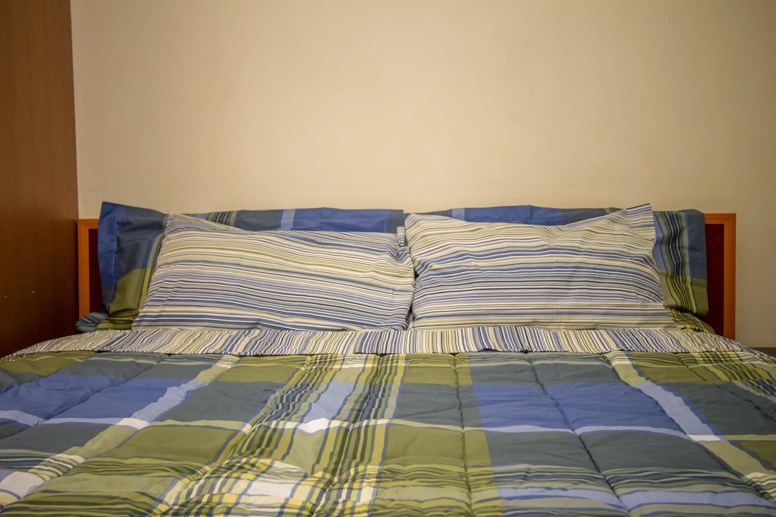 Bed in Grand Global Hotel