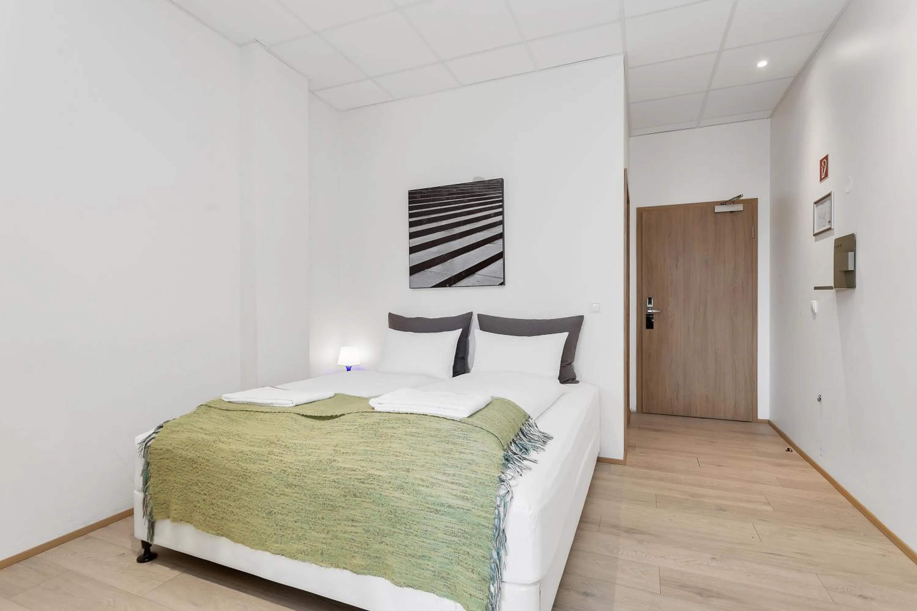 Bed in Blue Mountain Apartments by Heimaleiga