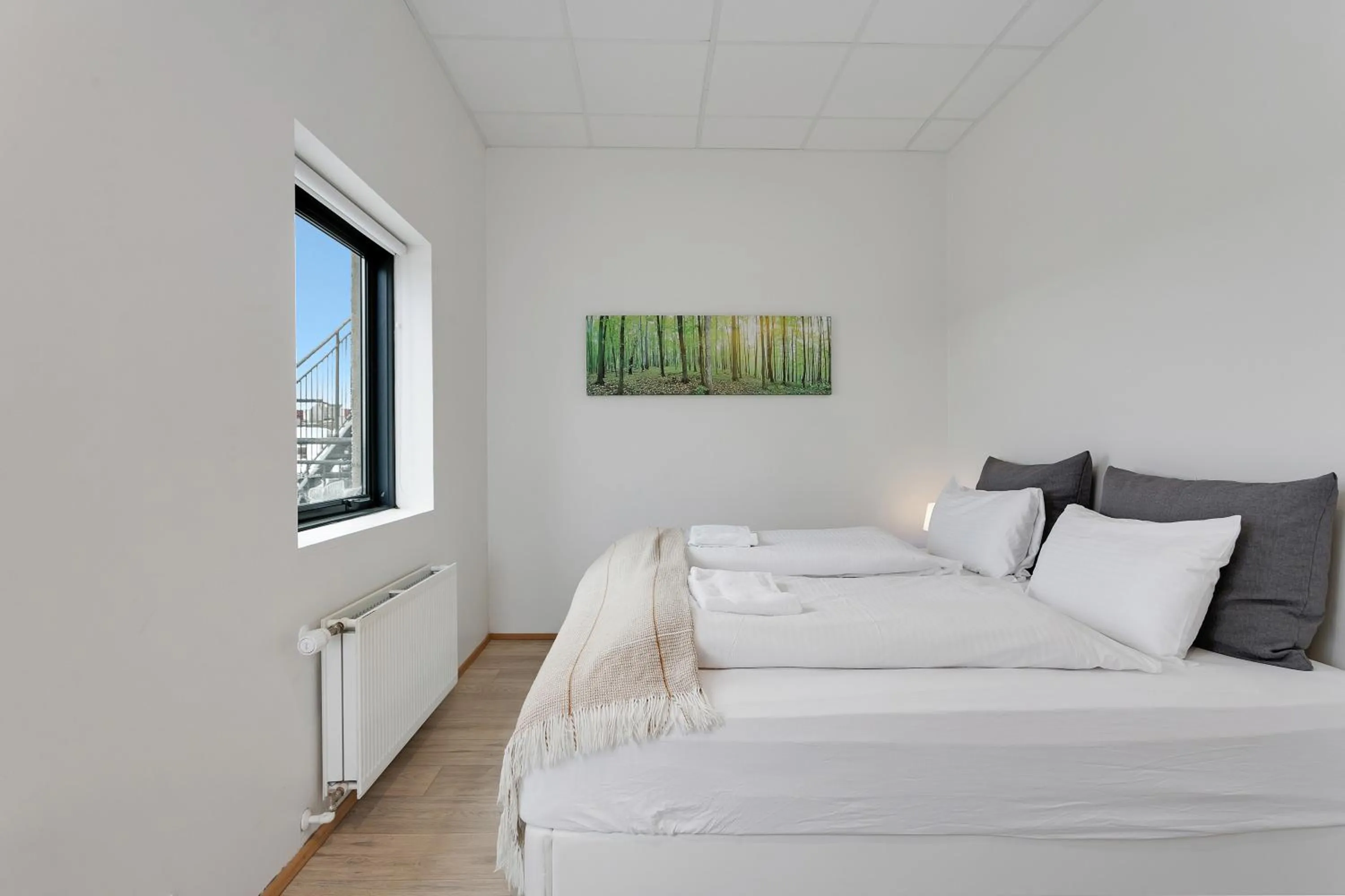 Bed in Blue Mountain Apartments by Heimaleiga