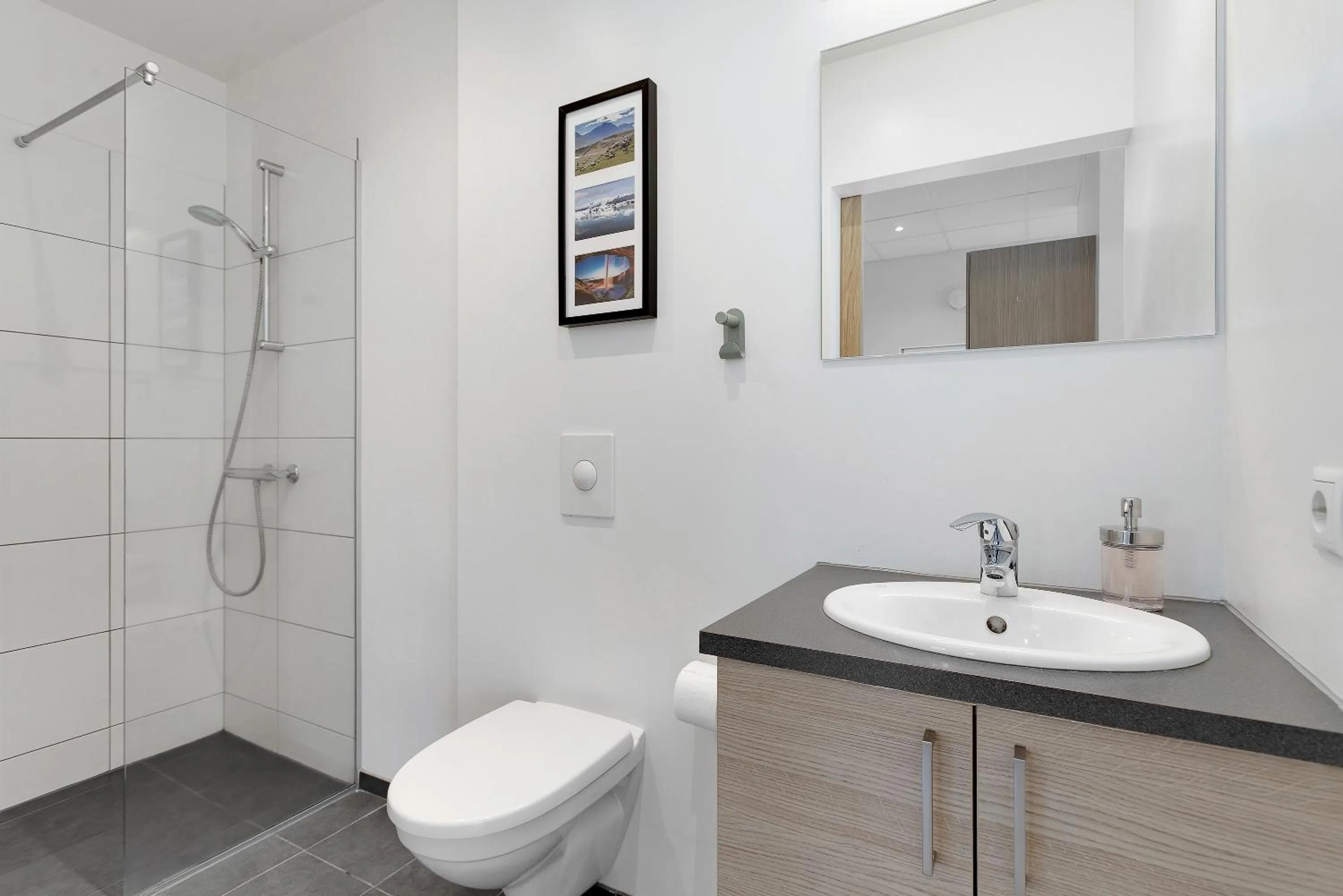 Shower in Blue Mountain Apartments by Heimaleiga