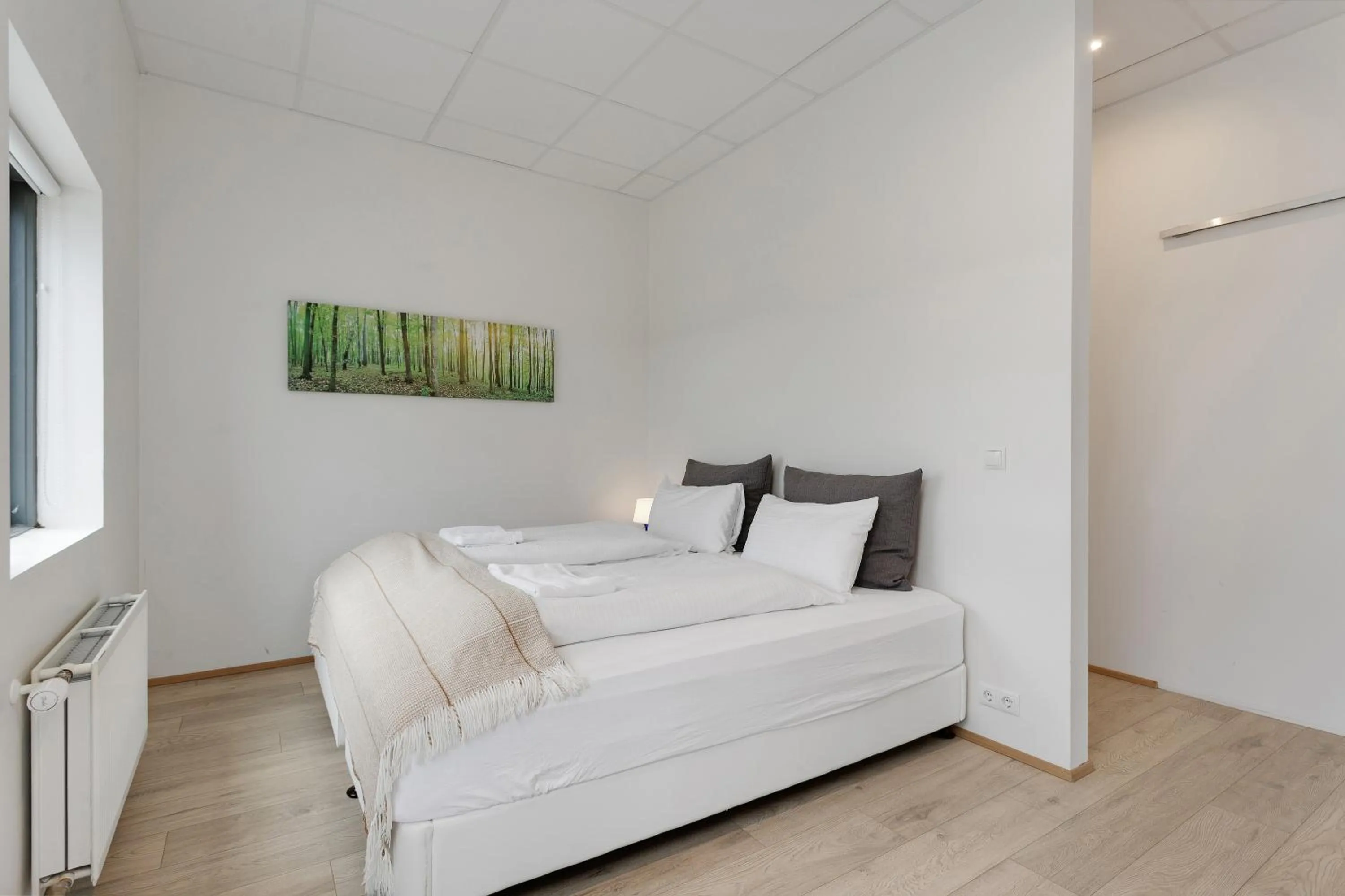 Bed in Blue Mountain Apartments by Heimaleiga