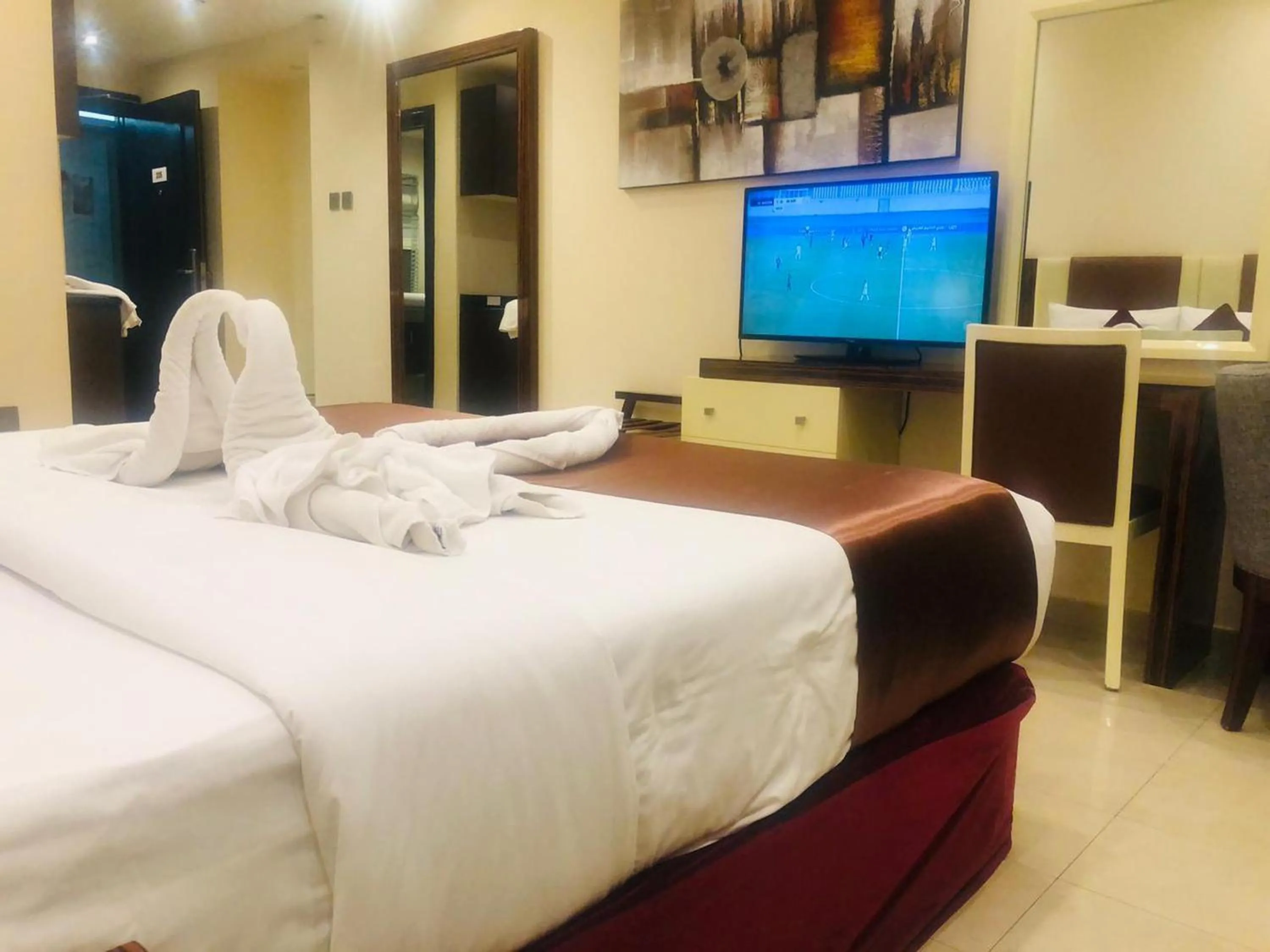 Communal lounge/ TV room, TV/Entertainment Center in The View Al Barsha Hotel Apartments