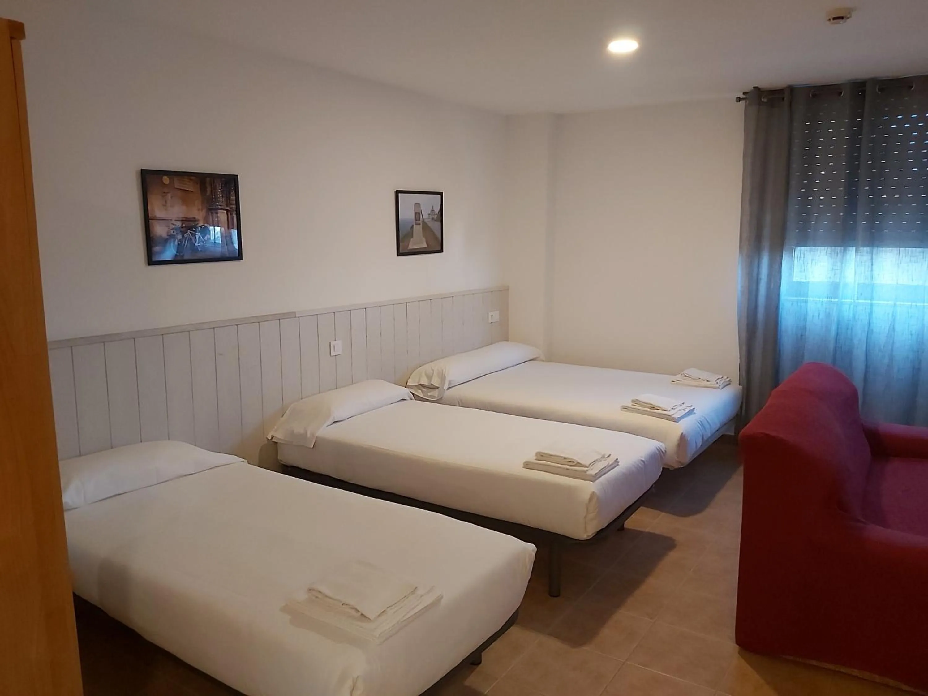 Photo of the whole room, Bed in Apartamentos Turísticos Cancelas by Bossh Hotels