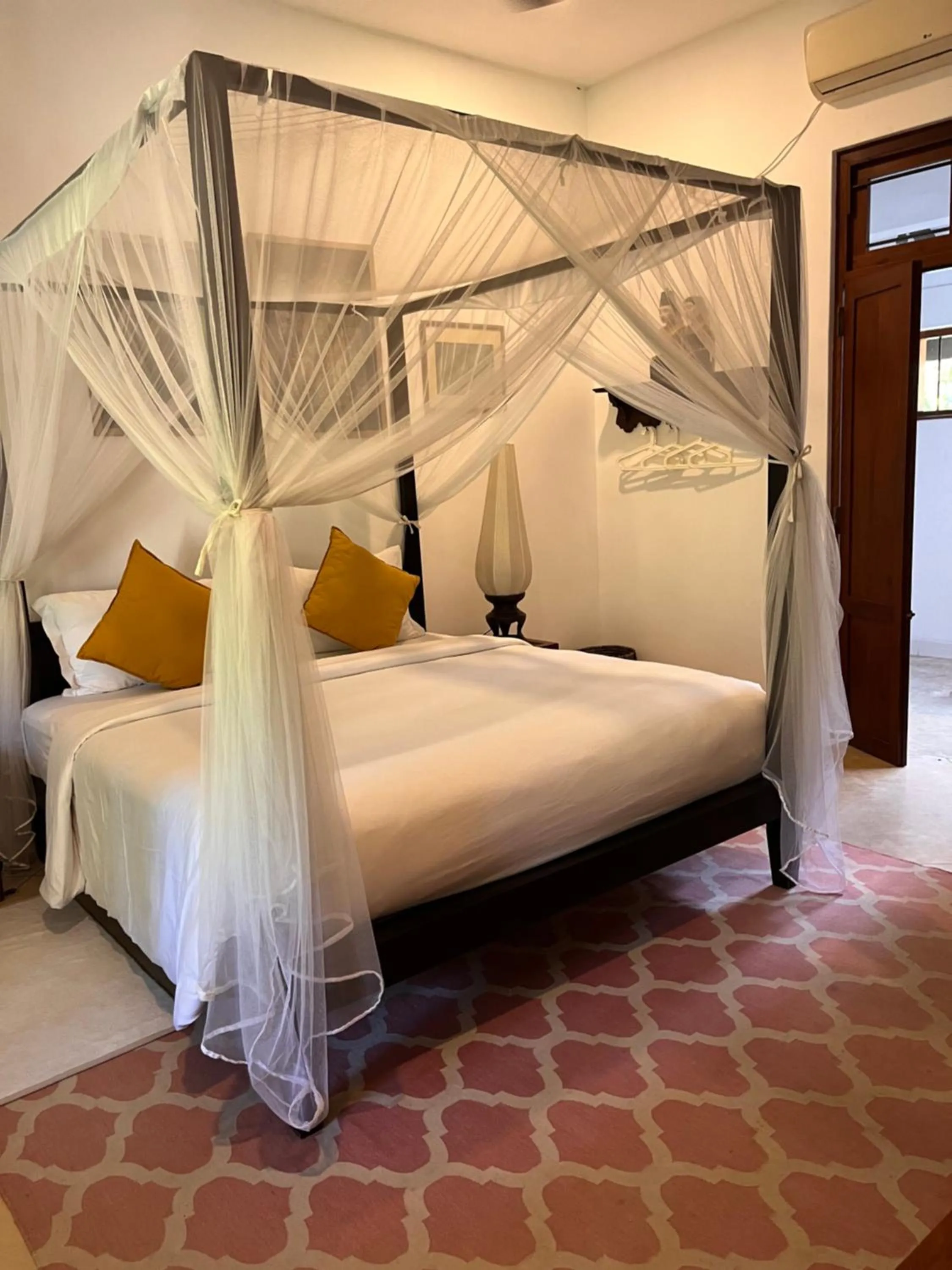 Photo of the whole room, Bed in Calamansi Cove Villas