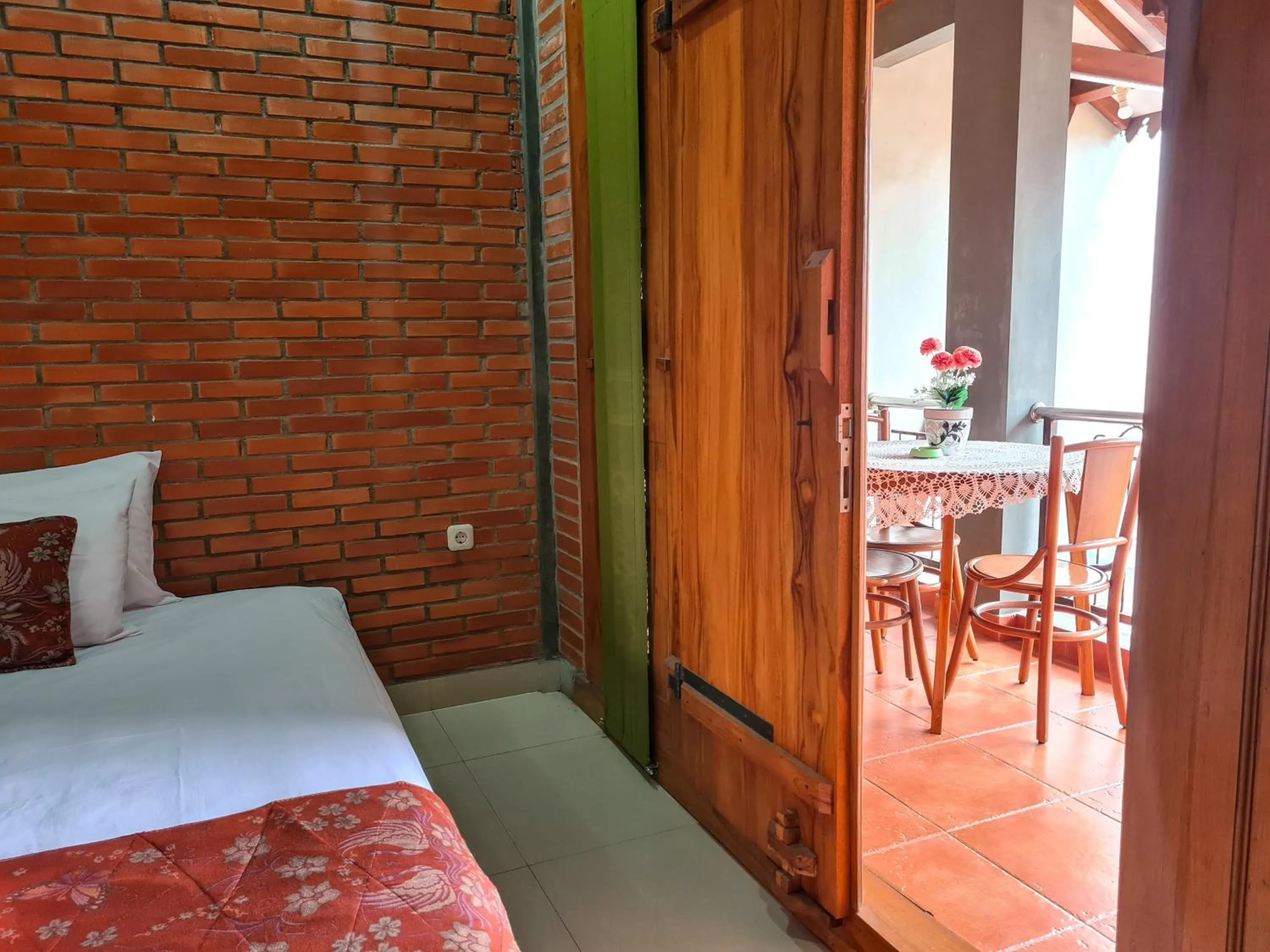 Balcony/Terrace, Bed in Ndalem Suryo Saptono Guest House