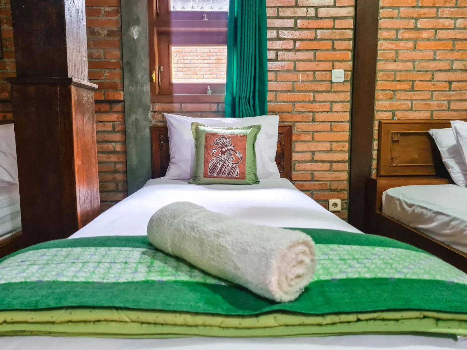 Bed in Ndalem Suryo Saptono Guest House