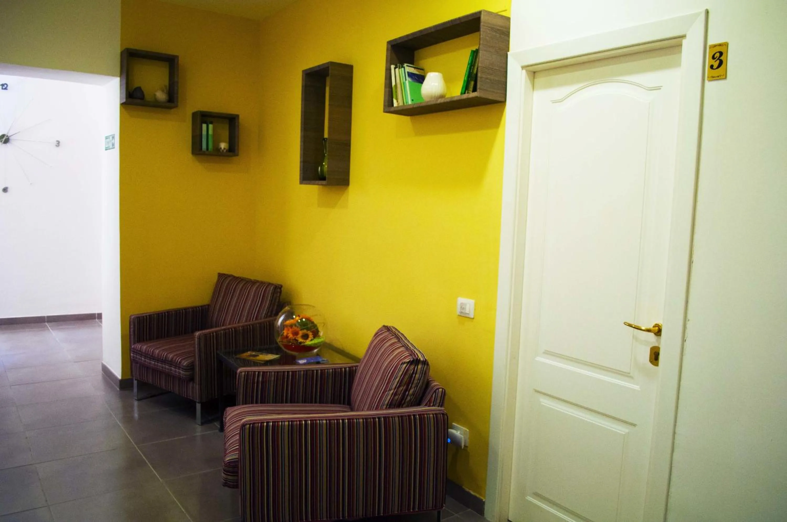 Communal lounge/ TV room in Il Giardinetto Guest House