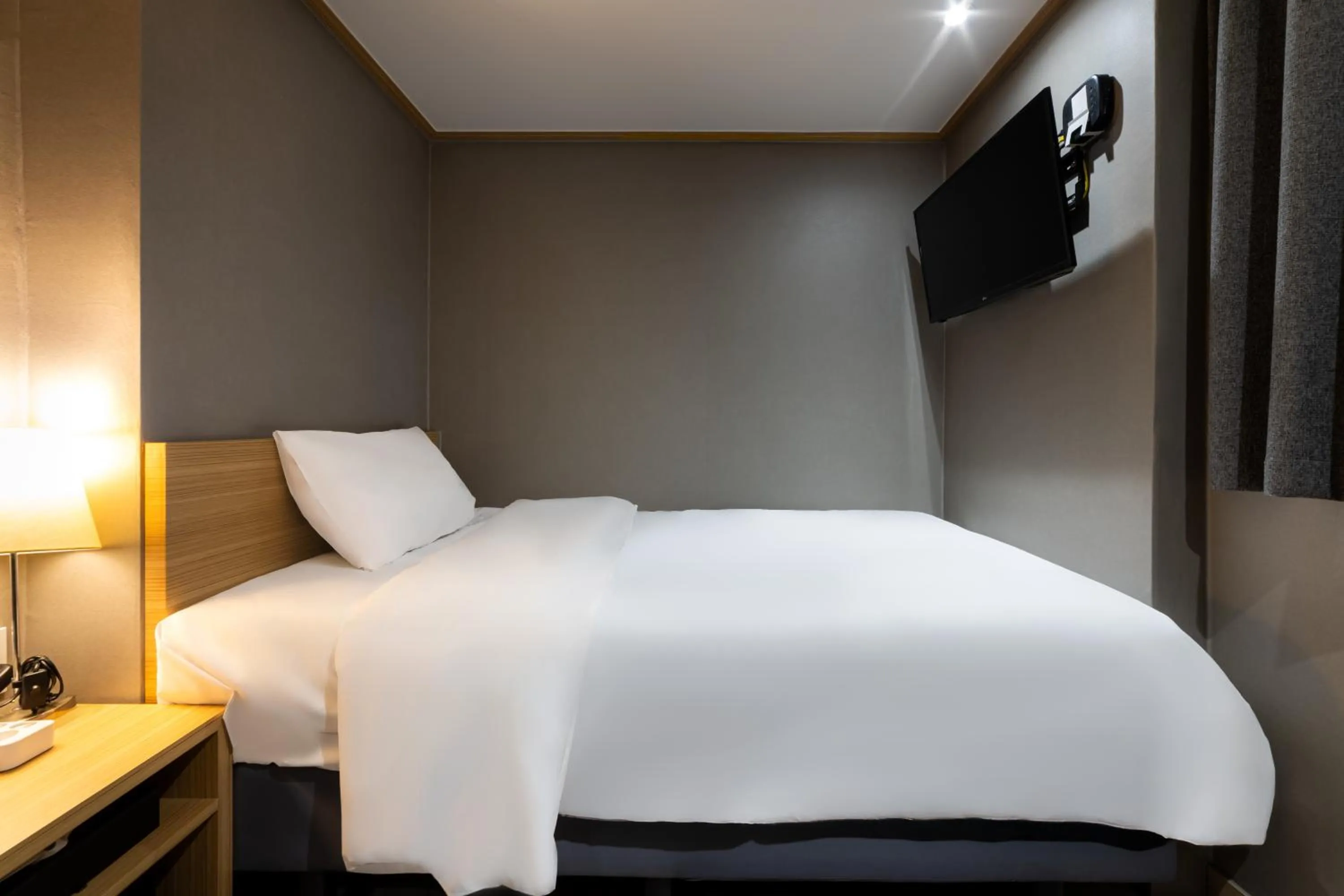 Bed in About Stay Seoul