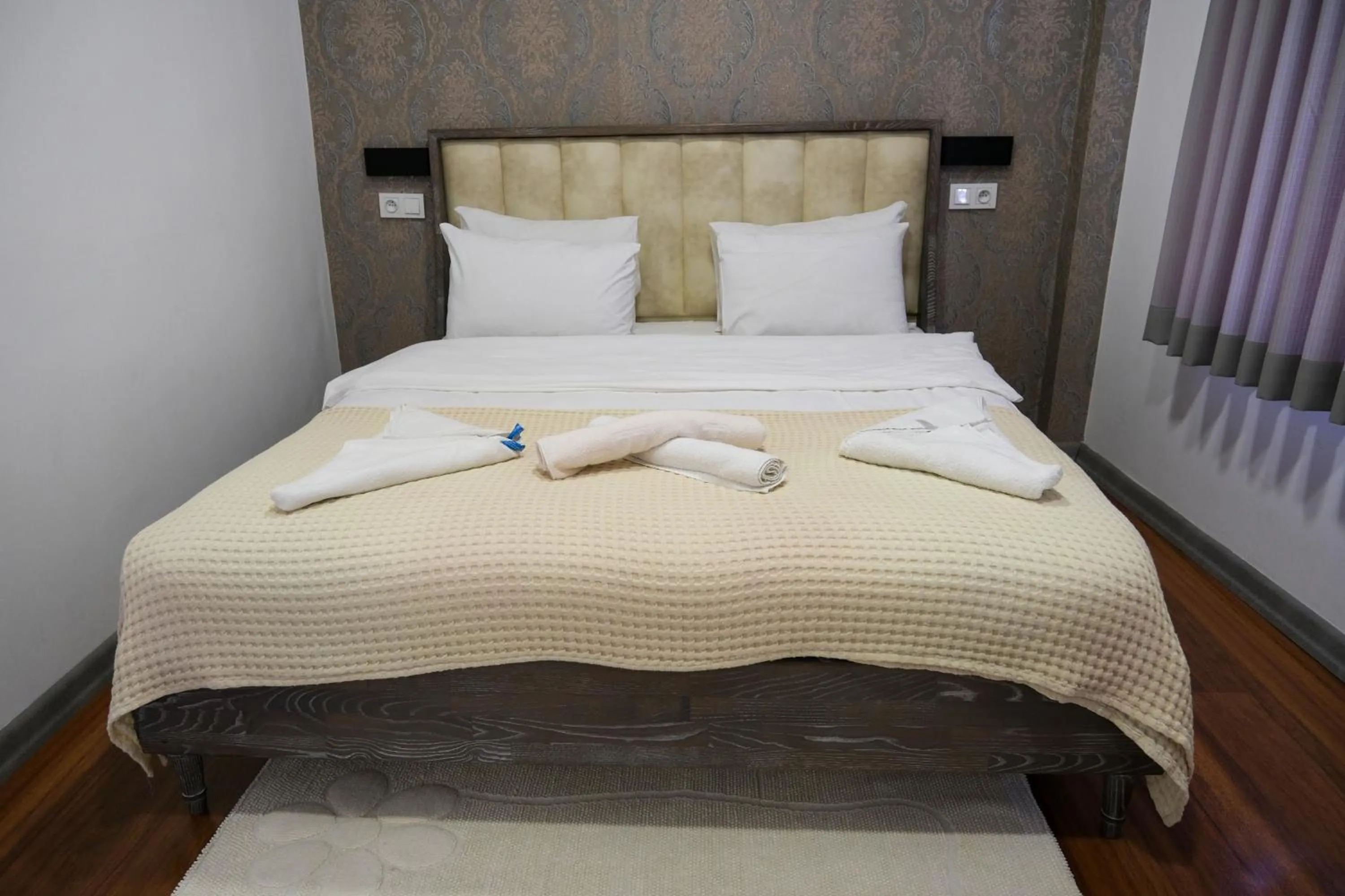 Bed in Taksim Neo Pera Suites