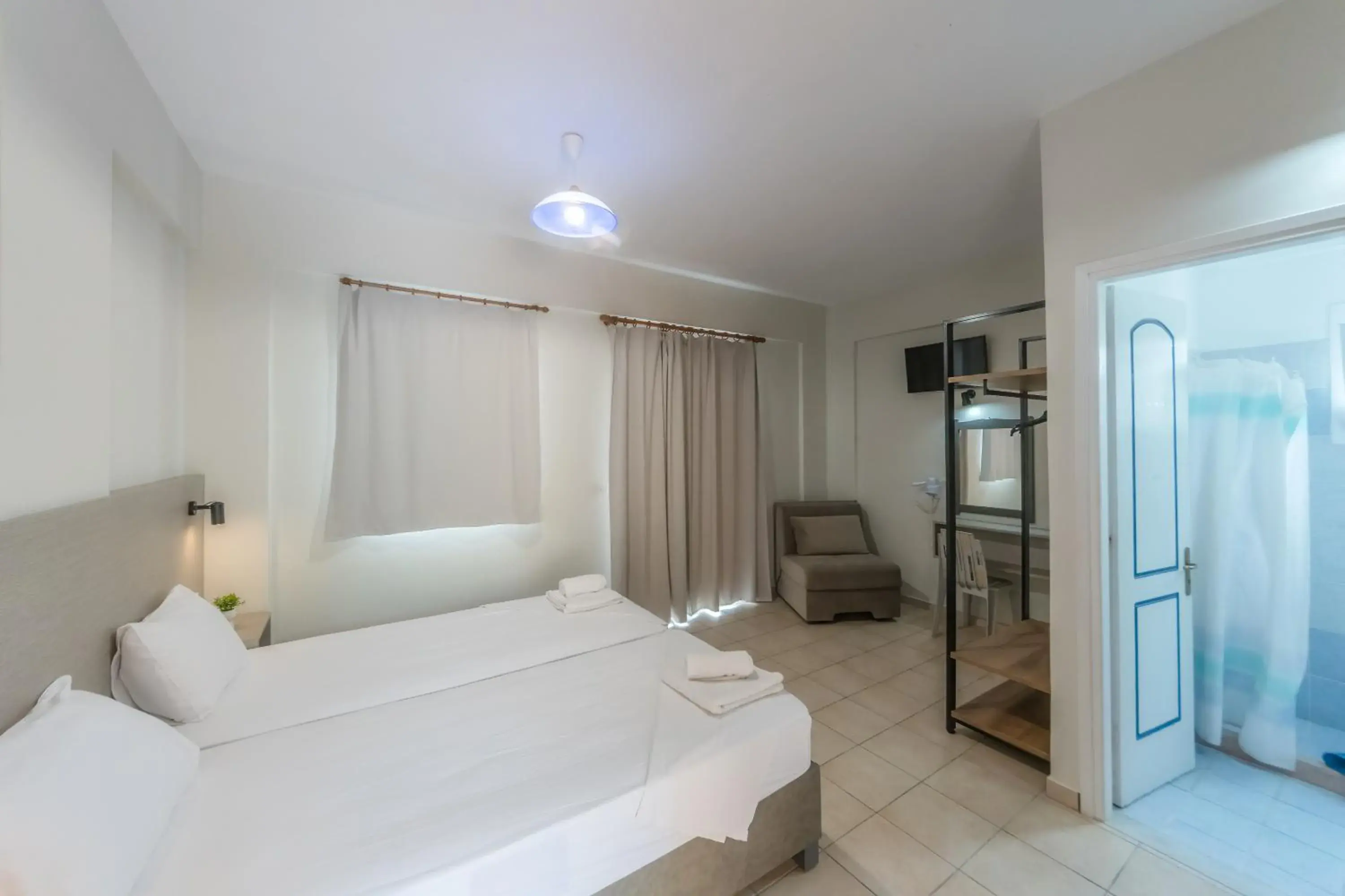 Triple Room with View in Nikos Villas Triple Room with View in Nikos Villas