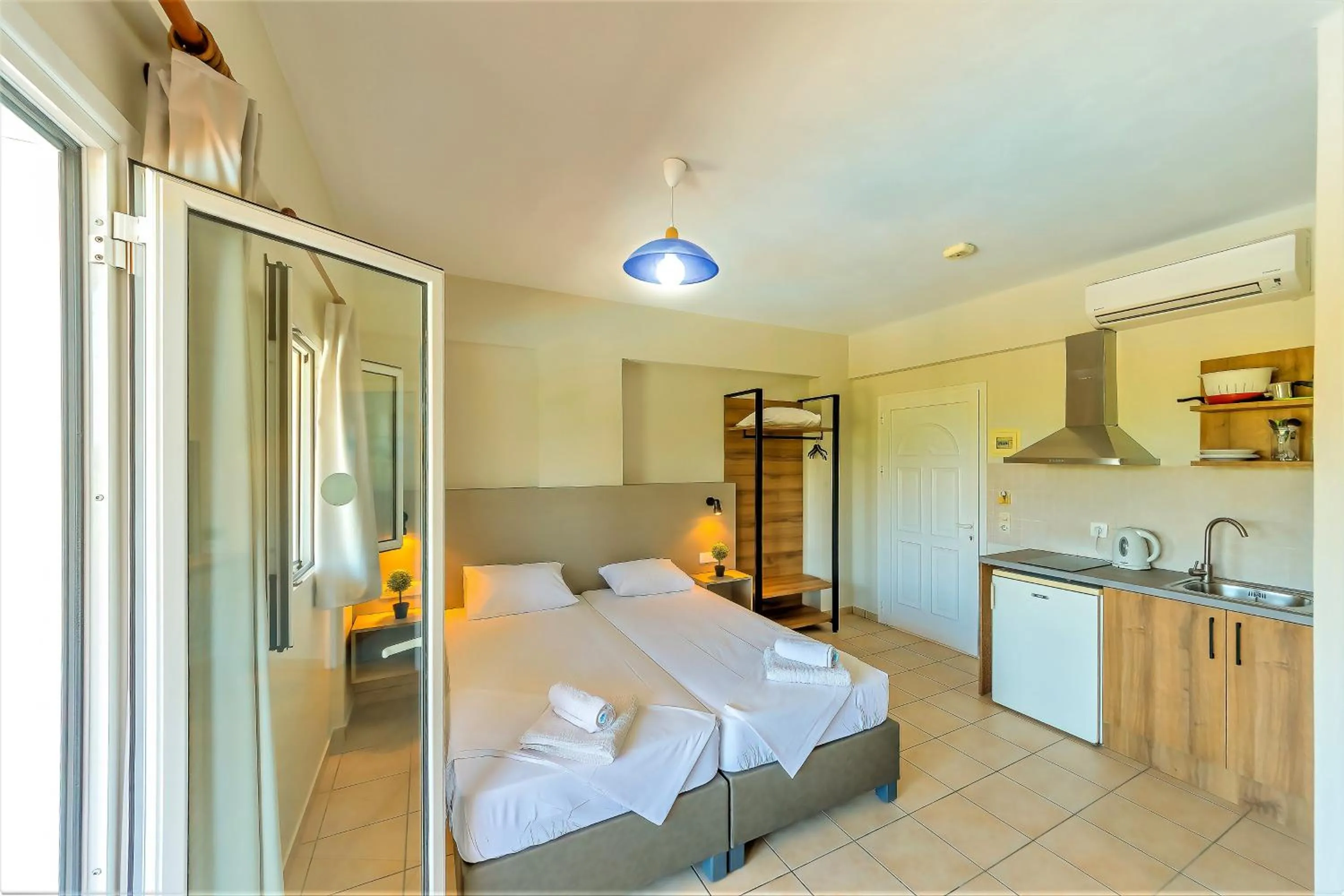 Kitchen or kitchenette, Bed in Nikos Villas