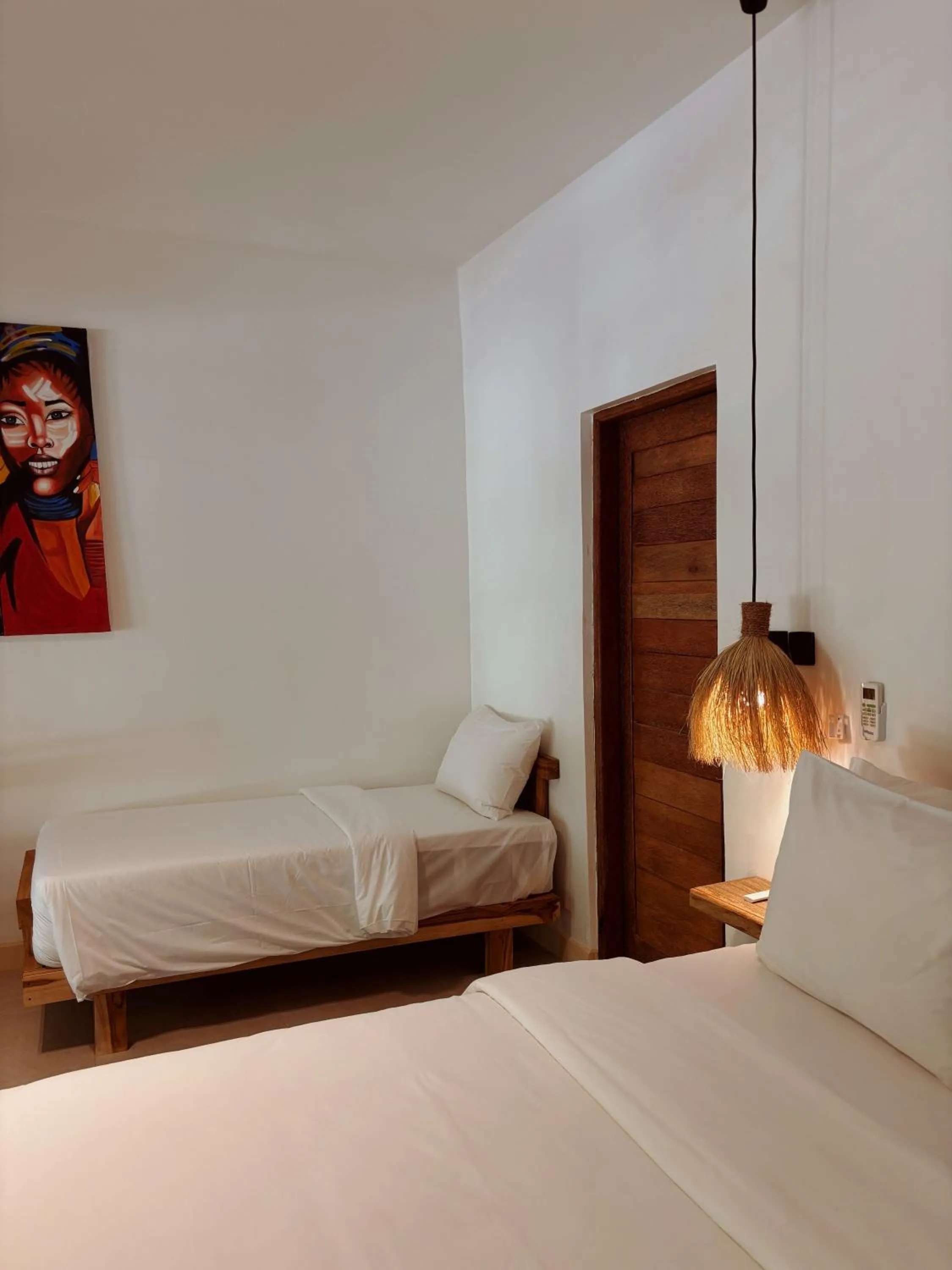 Bed in LUJO Zanzibar Resort