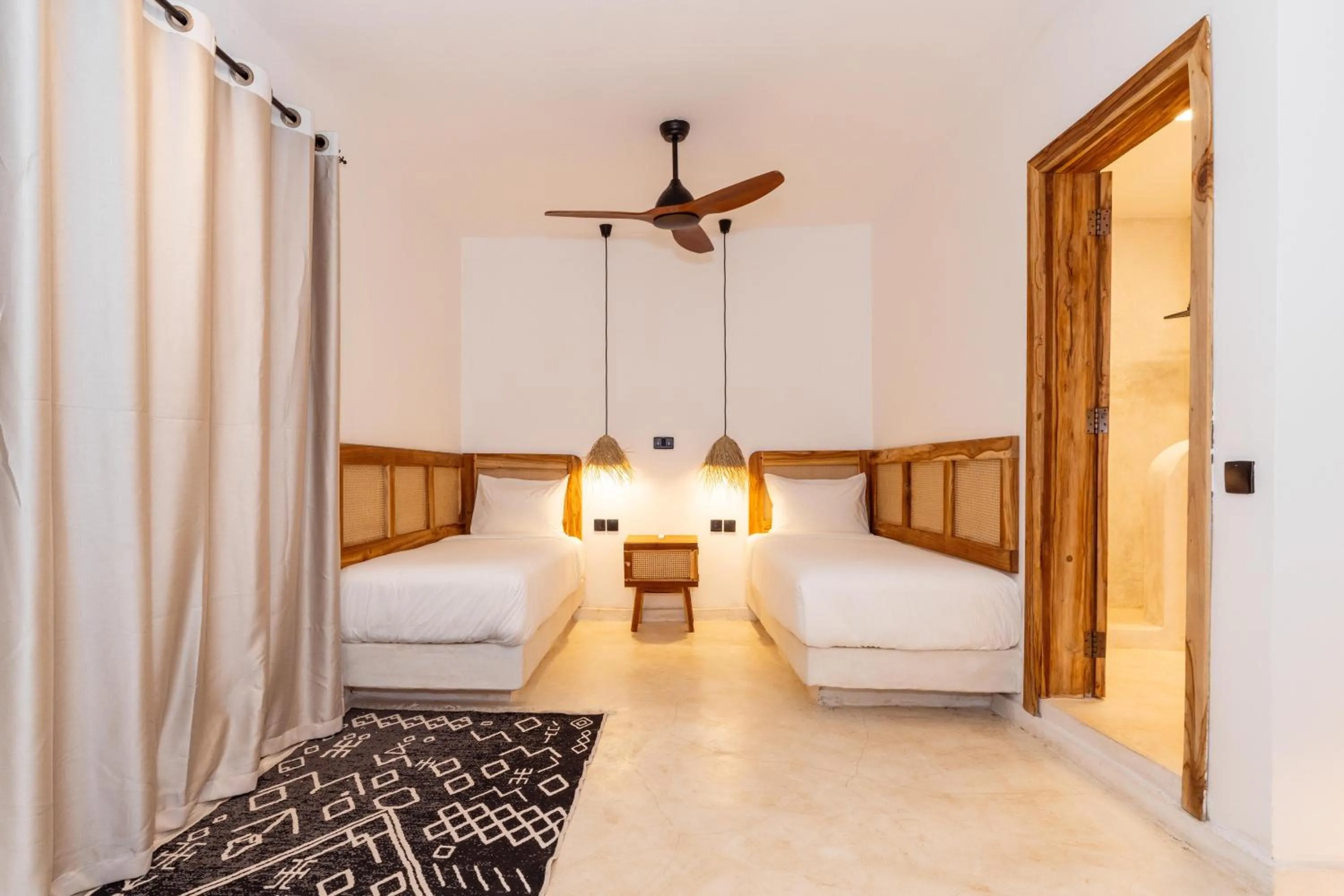 Bed in LUJO Zanzibar Resort