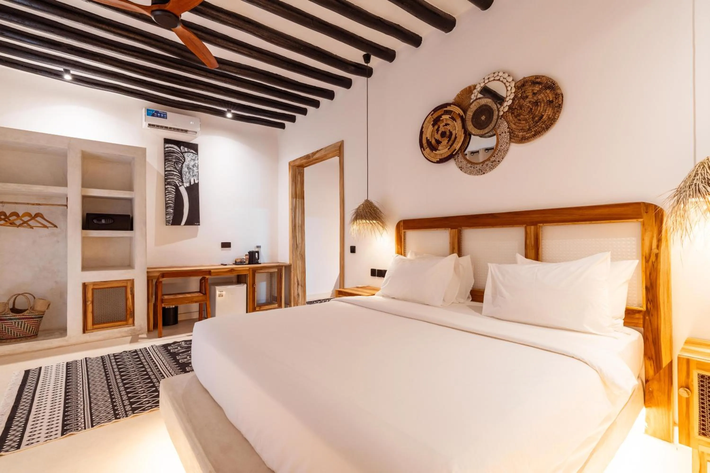 Bed in LUJO Zanzibar Resort